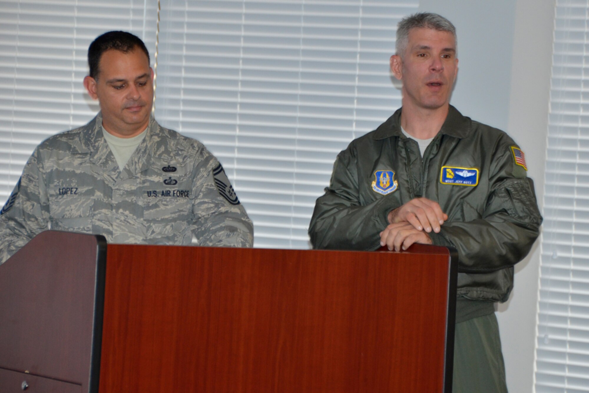 Senior Master Sgt. Larry Lopez, two term Top Three president and Master Sgt. Jeffery Botz, vice president, give final addresses to members before revealing results of the 2012 elections Dec. 4. (U.S. Air force photo/Master Sgt. James Branch)
