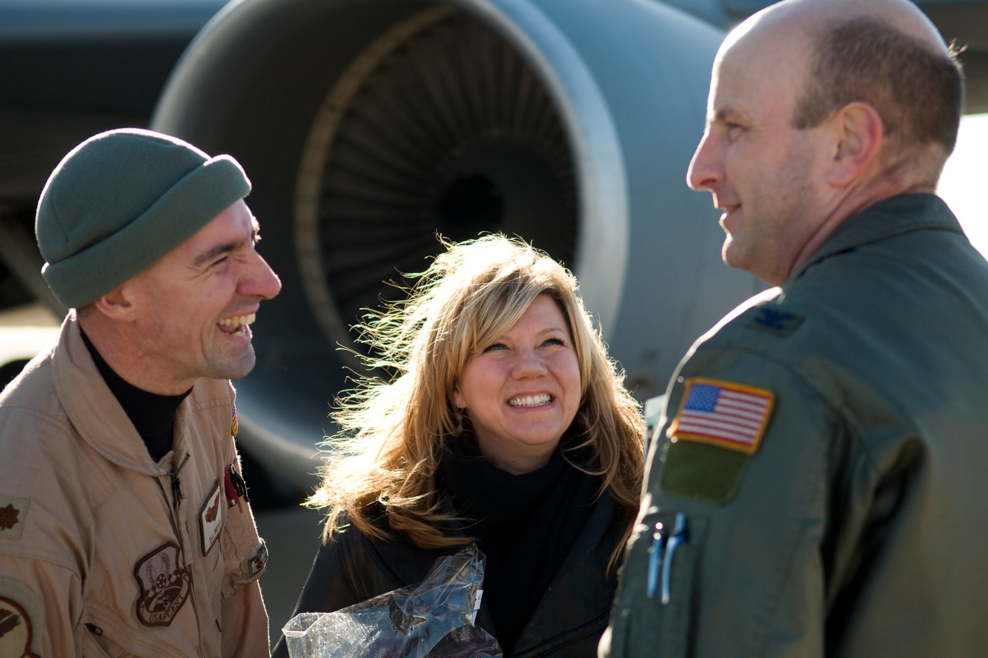 GRISSOM AIR RESERVE BASE, Ind. -- Maj. Billy Werth, left, and his wife Haley talk with Col. Christopher Amend shortly after the major returned from a deployment to Southwest Asia Jan. 5. Werth, who is a KC-135R Stratotanker pilot with the 72nd Air Refueling Squadron, deployed with several other 434th Air Refueling Wing Airmen for over two months in support of Operations Enduing Freedom and Odyssey Dawn. Amend is the 434th Operations Group commander. (U.S. Air Force photo/Tech. Sgt. Mark R. W. Orders-Woempner)
