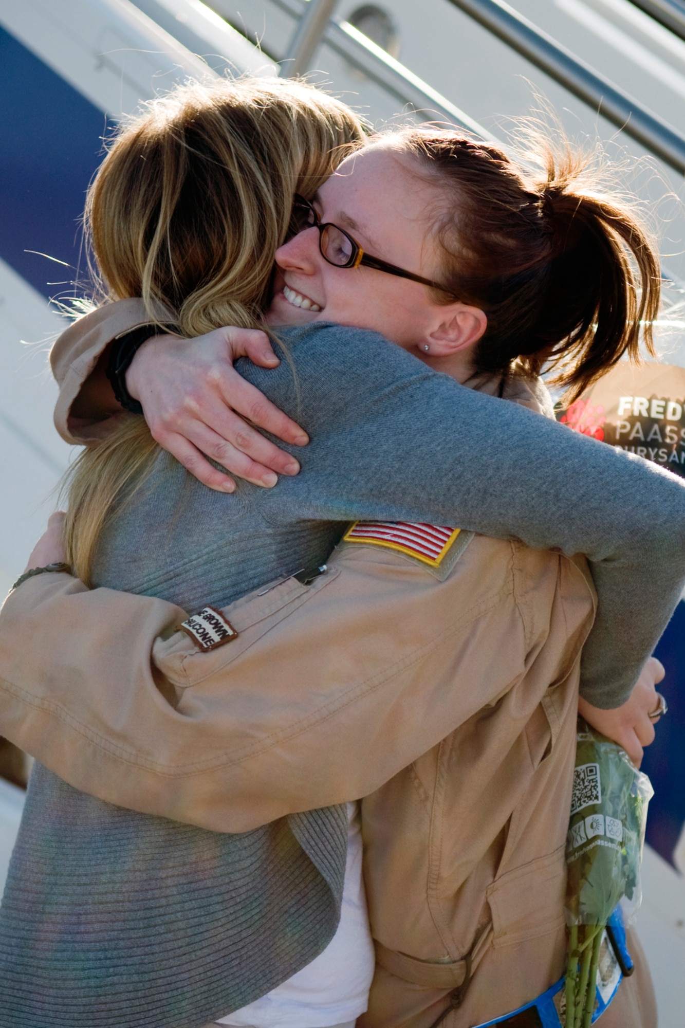 GRISSOM AIR RESERVE BASE, Ind. -- Staff Sgt. Crystal Nix, 72nd Air Refueling Squadron boom operator, gets a welcoming hug from Stephanie Creel after returning from a deployment to Southwest Asia Jan. 5. Nix deployed with several other 434th Air Refueling Wing Airmen for over two months in support of Operations Enduing Freedom and Odyssey Dawn. Creel is the wife of Capt. Jacob Creel, 72nd ARS pilot, who deployed with Nix. (U.S. Air Force photo/Tech. Sgt. Mark R. W. Orders-Woempner)
