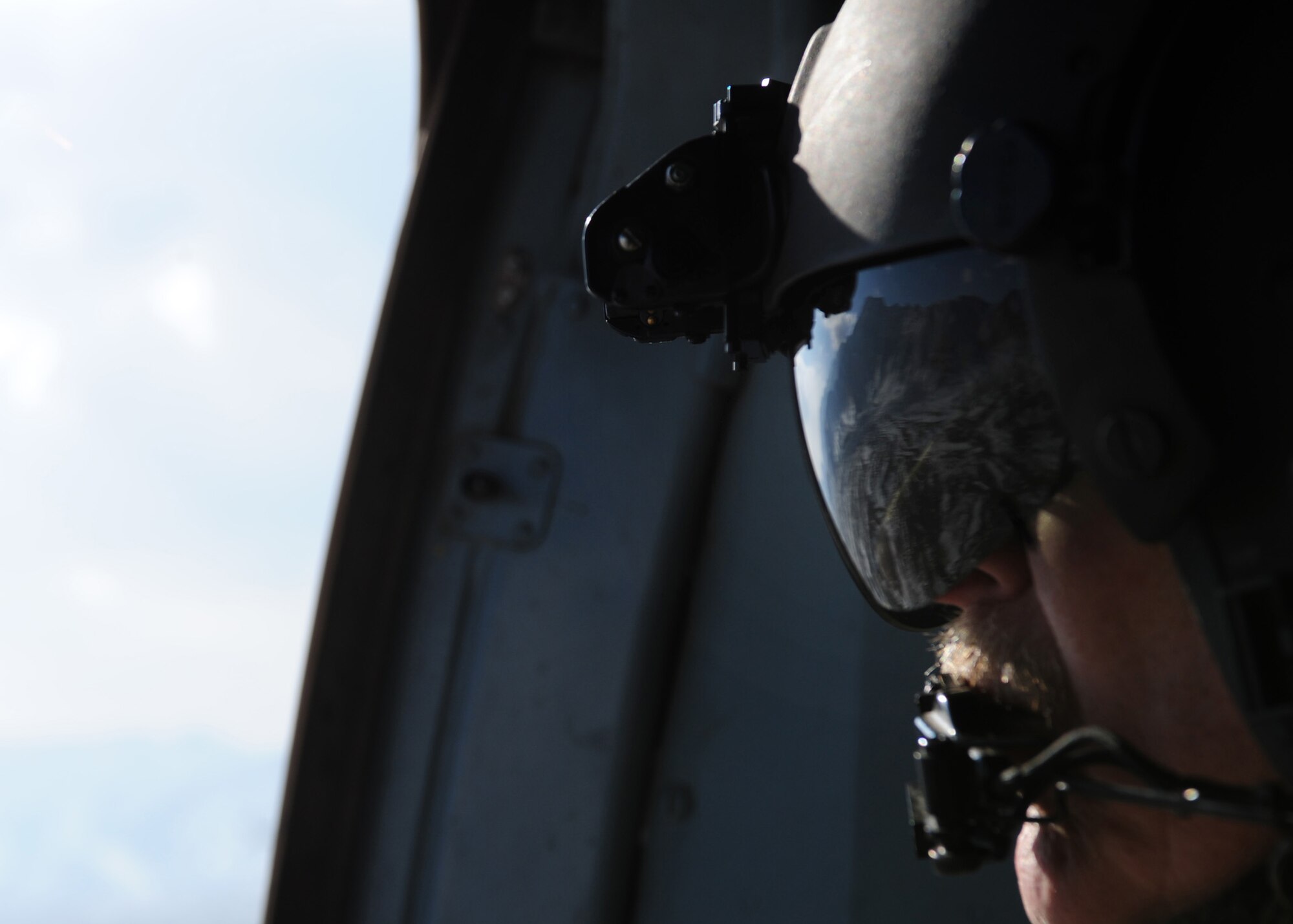 Senior Master Sgt. Todd Peplow, an aerial gunner with the 438th Air Expeditionary Advisory Squadron, provides gunner support on an Afghan air force MI-17 during a flight over Afghanistan, Jan. 2, 2012. Peplow is currently deployed to provide advisory training for AAF flight engineers at Kabul International Airport. (U.S. Air Force photo by Staff Sgt. Nadine Y. Barclay)