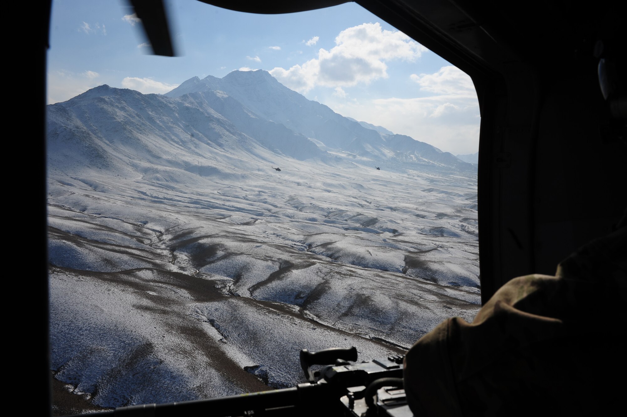 Afghan air force MI-17 helicopters fly in formation after completing a training mission, Northeastern Afghanistan, Jan. 5, 2012. The helicopters were flying from Jalalabad to Kabul International Airport. (U.S. Air Force photo by Staff Sgt. Nadine Y. Barclay)
