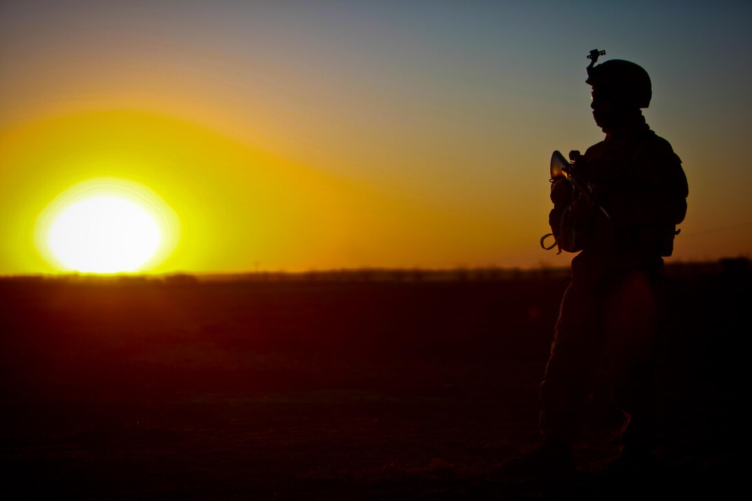 Lance Cpl.  Adam Ridgeway, a Chicago native and an infantryman with Echo Company, provides security for his fellow Marines as the sun begins to set.  Ridgeway and other Marines belonging to 2nd Battalion, 4th Marine Regiment, participated in Operation Double Check, in which they helped their Afghan counterparts clear the western side of the southern Musa Qal’eh riverbed to establish the presence of the Government of the Islamic Republic of Afghanistan there.