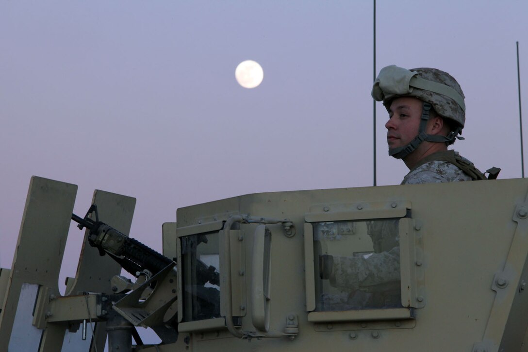 A Marine with 7th Engineer Support Battalion, 2nd Marine Logistics Group (Forward), supervises a portion of the Route Red improvement project in October 2011. As of Jan. 3, the surfacing portion of Route Red was completed. The improved road will benefit locals by connecting several major population centers west of the Helmand River, which in turn, will promote economic growth in the region. (U.S. Marine Corps photo by Staff Sgt. Jeff Kaus)
