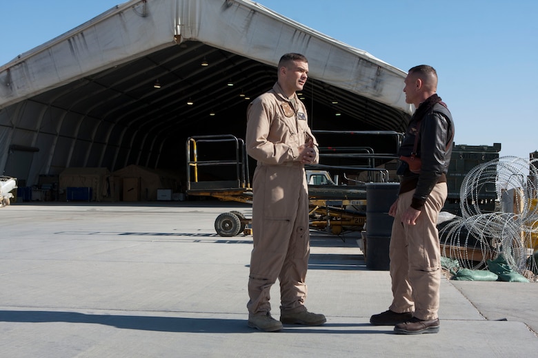 Maj. Gen. Jon M. Davis, right, 2nd Marine Aircraft Wing commanding general, speaks with Lt. Col. Mark Revor, commanding officer of Marine Heavy Helicopter Squadron 363, at Camp Bastion, Afghanistan, Jan. 8. Davis visited Camp Bastion to present awards to Marines of HMH-363 in recognition of their performance supporting operations in southwestern Afghanistan with 2nd Marine Aircraft Wing (Forward).::r::::n::To connect with the Marines in Afghanistan visit http://www.facebook.com/regionalcommandsouthwest::r::::n::