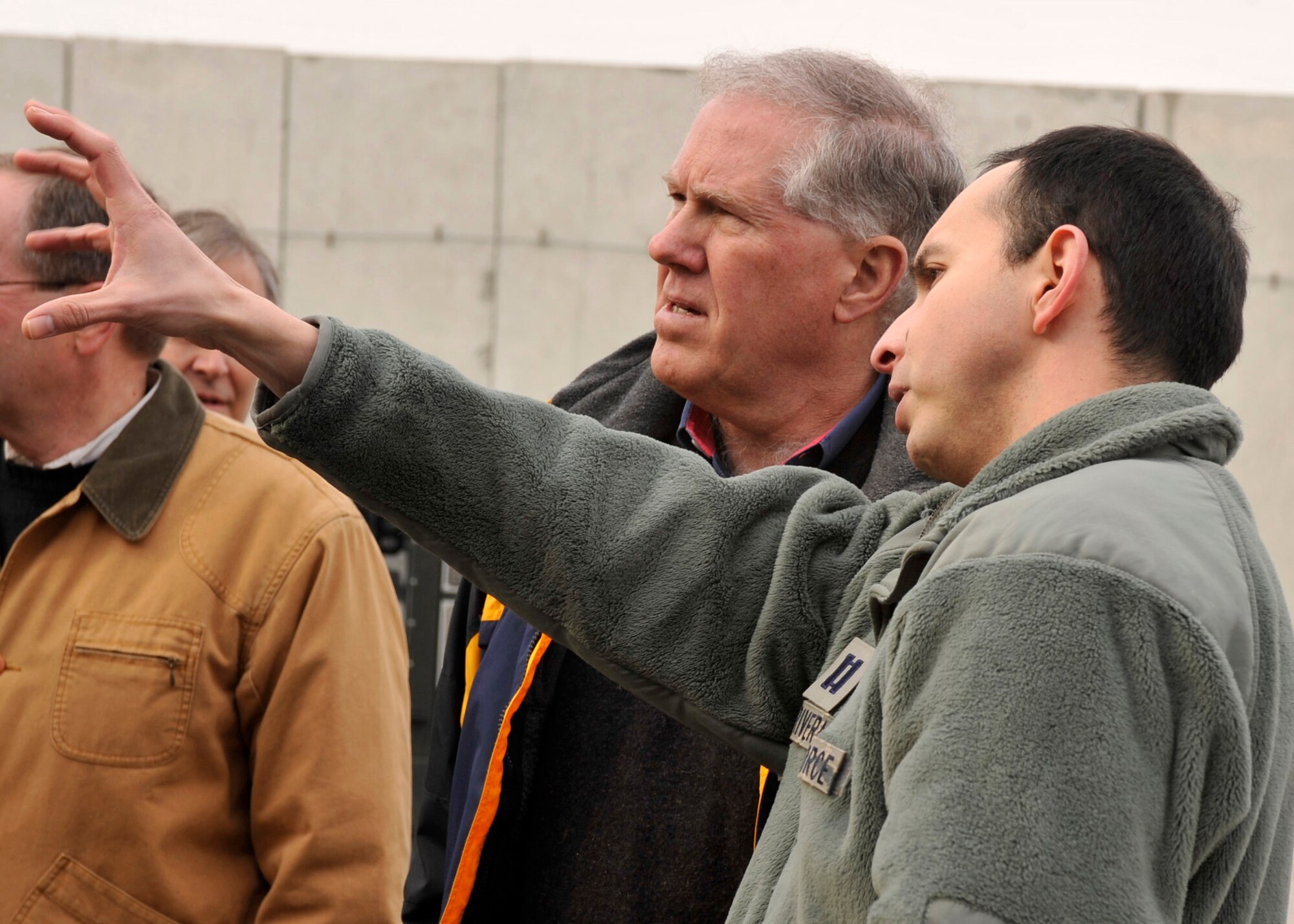 BAGRAM AIRFIELD, Afghanistan-- Capt. Ernest Rivera discusses a function of the EC-130 Aircraft with Honorable Frank Kendall at Bagram Airfield, Afghanistan, Jan. 8, 2012. Kendall is principal deputy under secretary of defense for Acquisition, Technology and Logistics. Rivera is a senior mission crew commander with the 455th Aircraft Maintenance Squadron; he is deployed from Davis-Monthan Air Force Base, Ariz. (U.S. Air Force photo/ Airman 1st Class Ericka Engblom)