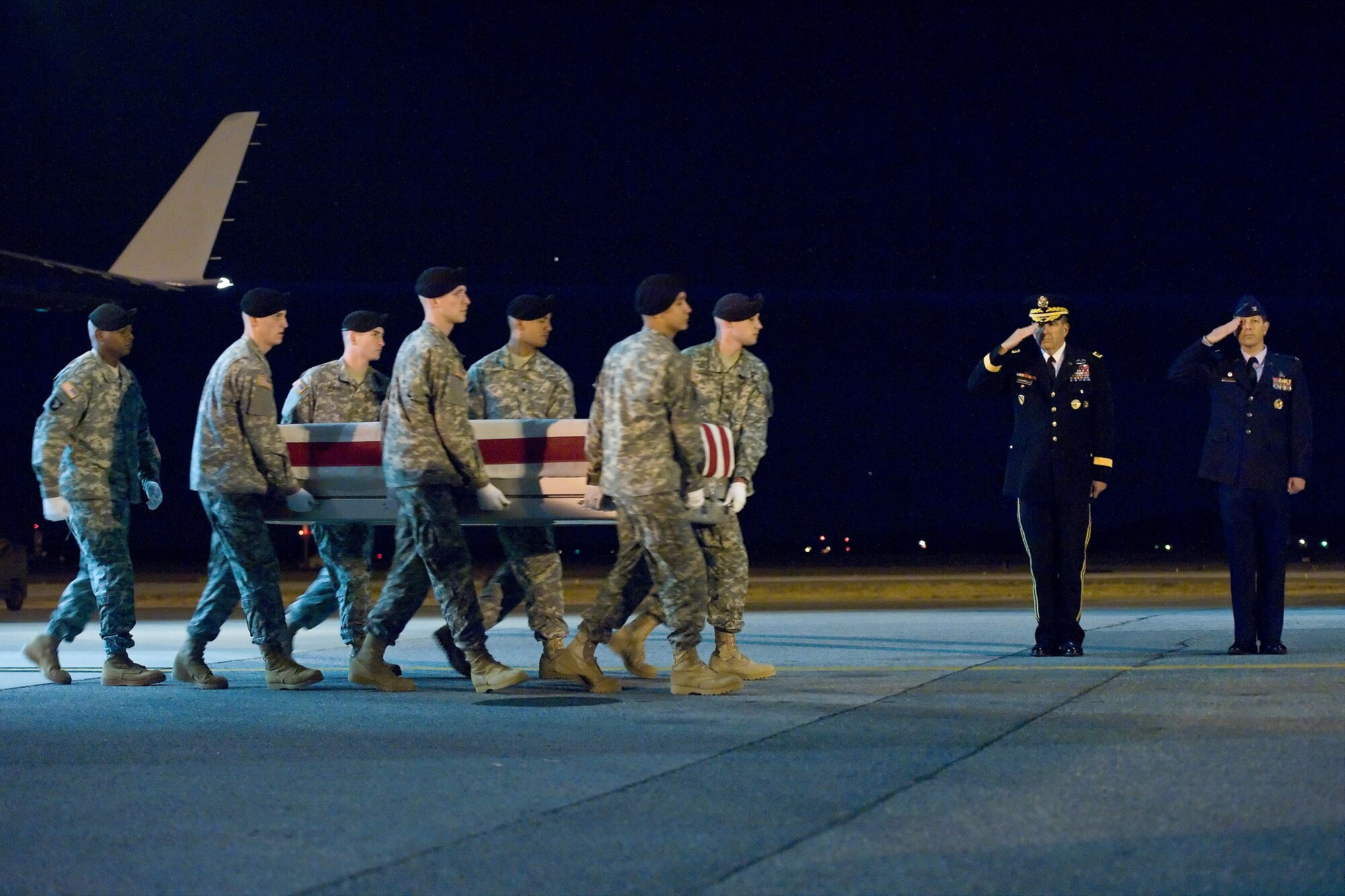 A U.S. Army carry team transfers the remains of Army Spc. Robert J. Tauteris Jr., of Hamlet, Ind., at Dover Air Force Base, Del., Jan. 8, 2012. Tauteris was assigned to the 713th Engineer Company, Indiana National Guard, Valparaiso, Ind. (U.S. Air Force photo/Roland Balik)