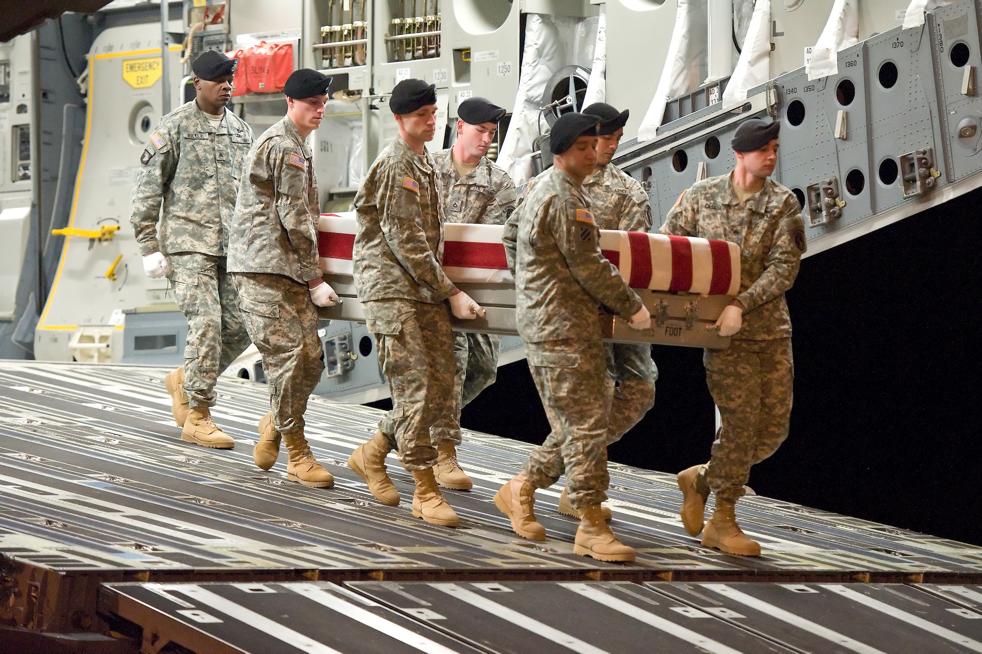 A U.S. Army carry team transfers the remains of Army Staff Sgt. Jonathan M. Metzger, of Indianapolis, Ind., at Dover Air Force Base, Del., Jan. 8, 2012. Metzger was assigned to the 713th Engineer Company, Indiana National Guard, Valparaiso, Ind. (U.S. Air Force photo/Roland Balik)
