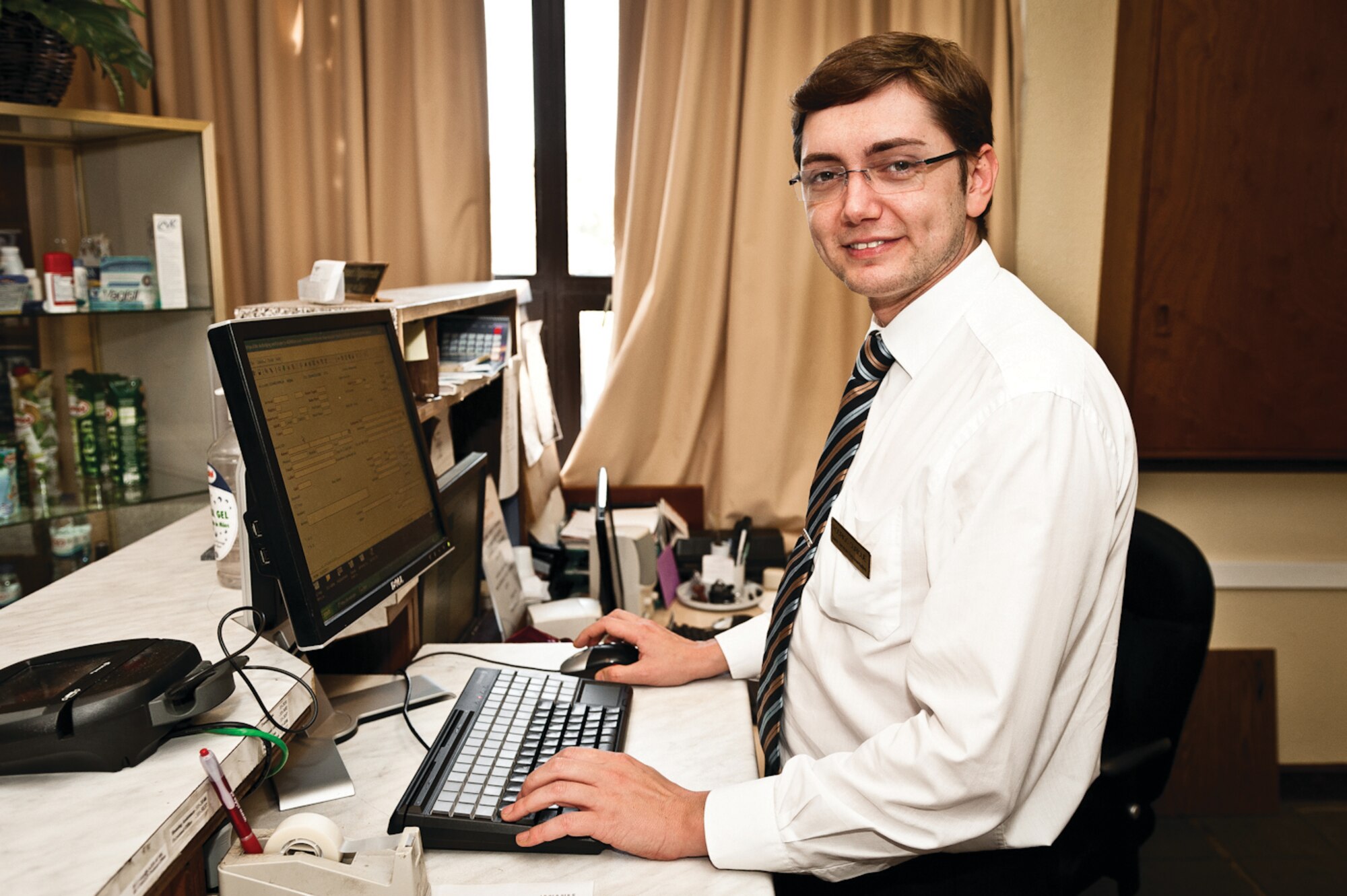Ricardo Ourique, the third generation of the Ourique family, at his duty station as a Lajes lodging clerk, January 2012.  (Photo by Lucas Silva)