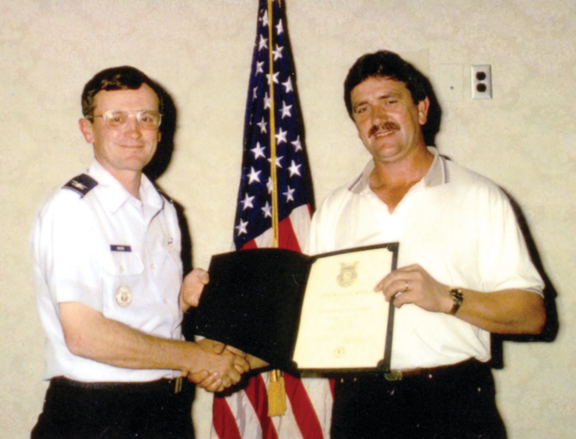 Senhor Agnelo Ourique, a firefighter at the Lajes Fire Department since 1986, receives an award the 65th Civil Engineer commander.  (Courtesy photo)