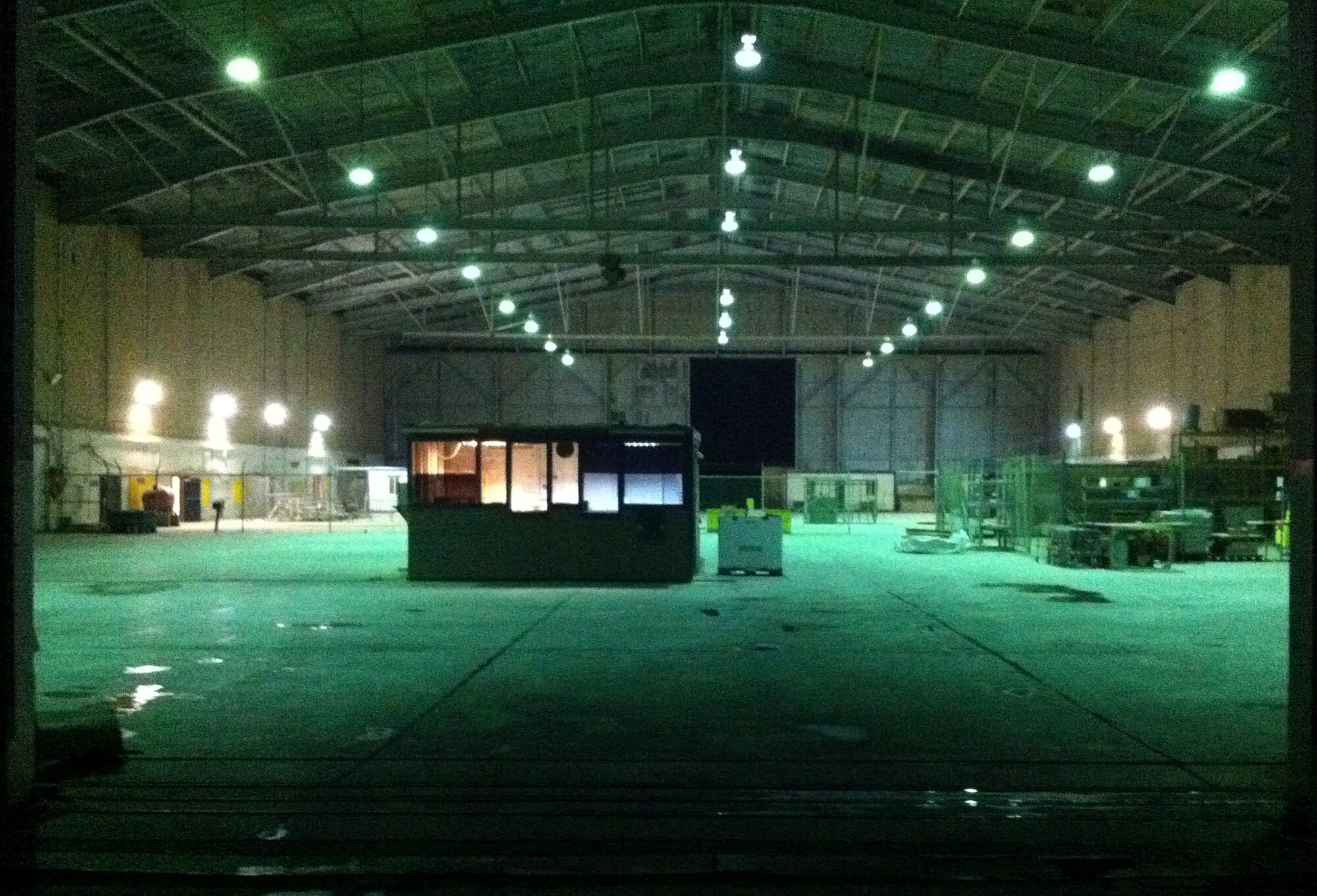 The supply warehouse, which once teamed with  forklifts, supply clerks and customers sits empty as the remaining U.S. military members left Kirkuk Regional Air Base, Iraq in November 2011.