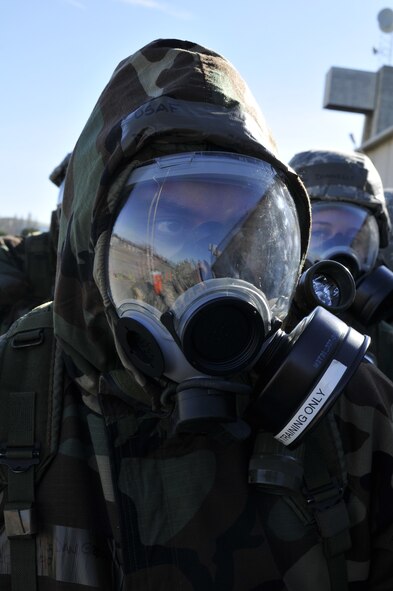 Air National Guard Senior Master Sgt. Daniel Greenawalt, an intelligence superintendent assigned to the 129th Operations Support Flight, prepares to enter a decontamination station at Moffett Federal Airfield, Calif.,  Jan. 7, 2012. Greenawalt is conducting war skills training in preparation for the wing’s upcoming Phase II Operational Readiness Inspection. The Phase II ORI evaluates the wing during a simulated deployment. (Air National Guard photo by Staff Sgt. Kim E. Ramirez)