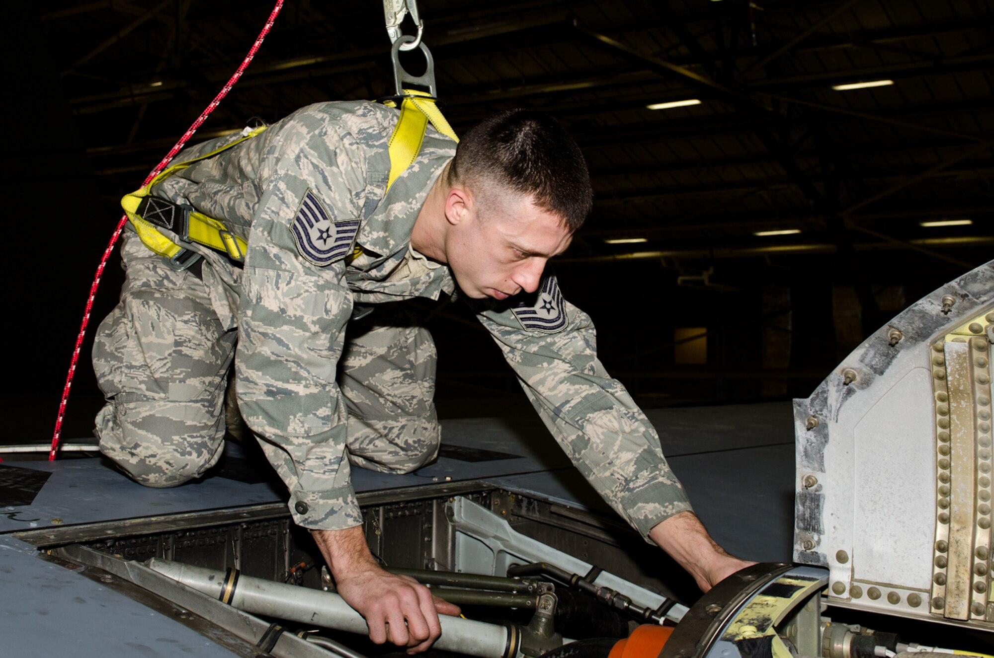 Tech. Sgt. Fred Pierce, 139th Aircraft Maintenance Squadron crew chief, examines the turboprop engine of a C-130 Hercules aircraft at Rosecrans Air National Guard Base, St. Joseph, Mo., on Dec. 29, 2011. Pierce was selected as the Outstanding Noncommissioned Officer of the Year for the Missouri Air National Guard. (Missouri Air National Guard photo by Staff Sgt. Michael Crane)