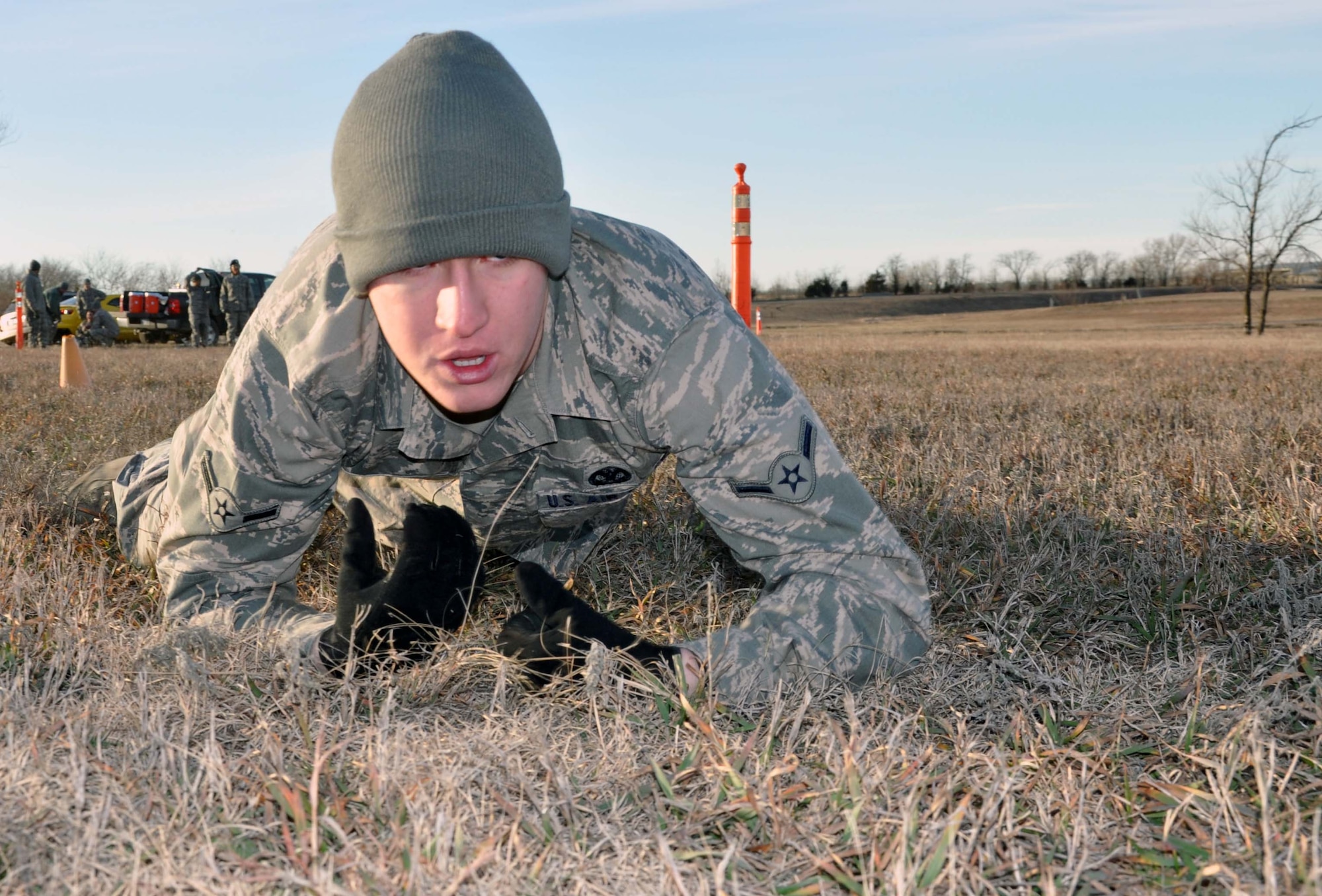 Airmen Ryan Flock, 931st Security Forces Squadron, performs a high-crawl while maneuvering through a combat fitness test course at McConnell Air Force Base, Kan., Jan. 7, 2012.  The combat fitness test was part of a two-day combat training regimen conducted by the squadron during the January Unit Training Assembly.  (U.S. Air Force photo by 1st Lt. Zach Anderson) 