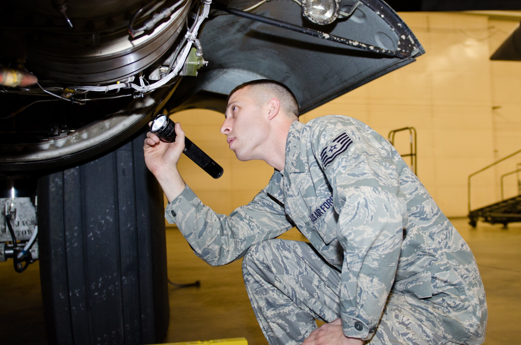 Tech. Sgt. Fred Pierce, 139th Aircraft Maintenance Squadron crew chief, inspects an auxiliary power unit on a C-130 Hercules aircraft at Rosecrans Air National Guard Base, St. Joseph, Mo., on Dec. 29, 2011. Pierce was selected as the Outstanding Noncommissioned Officer of the Year for the Missouri Air National Guard. (Missouri Air National Guard photo by Staff Sgt. Michael Crane)