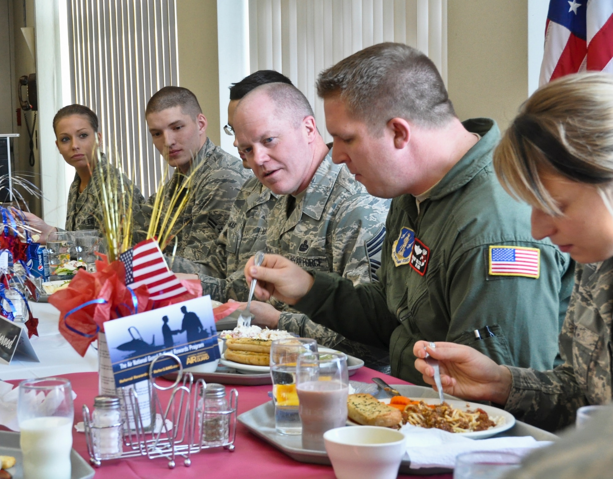 Command Chief Master Sgt. Christopher E. Muncy, command chief of the Air National Guard, prepares to answer questions posed by members of the 128th Air Refueling Wing's enlisted Airmen while having lunch at Sijan Hall in Milwaukee on January 08, 2012. Muncy was at the 128 ARW in part of tour of all the Air National Guard bases located in Wisconsin. USAF Photograph by Staff Sgt. Jeremy Wilson