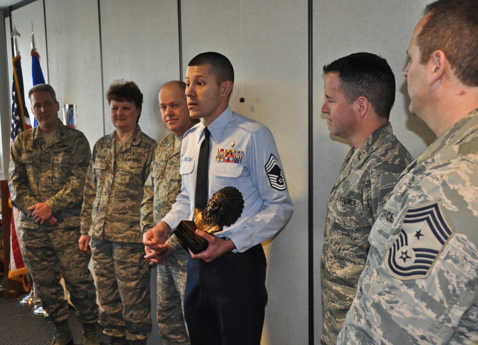 Chief Master Sgt. Antonio Marrero addresses his fellow Airmen of the 128th Air Refueling Wing's medical group after being presented with a chief's bust in Milwaukee on January 08, 2012. The Command Chief Master Sgt. of the Air National Guard, Christopher E.  Muncy, was at the 128 ARW, a stop in his tour of the Air National Guard bases located in Wisconsin, and presented the award to Marrero in recognition of his recent promotion to chief master sergeant. USAF Photograph by Staff Sgt. Jeremy Wilson