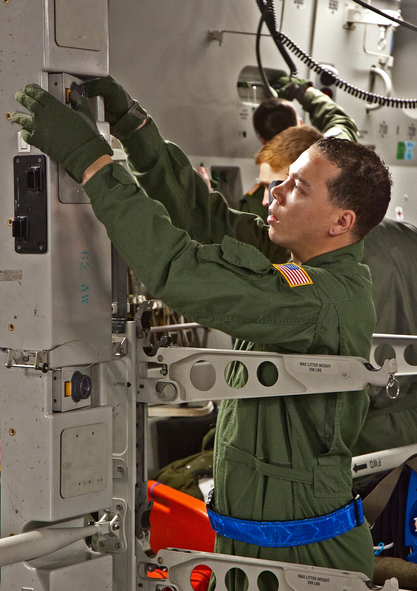 Senior Airman Ricky Young, 446th Aeromedical Evacuation Squadron helps configure a C-17 Globemaster III to carry 36 litters during a squadron exercise.  More than 30 446th AES members participated in the flight departing from McChord Field Jan. 8, 2012.  The exercise included scenarios where patients injured in combat needed to be loaded and cared for on a four-hour flight around the local area.  These training exercises occur monthly and enable Reservists to hone their skills for real-world deployments and humanitarian missions.