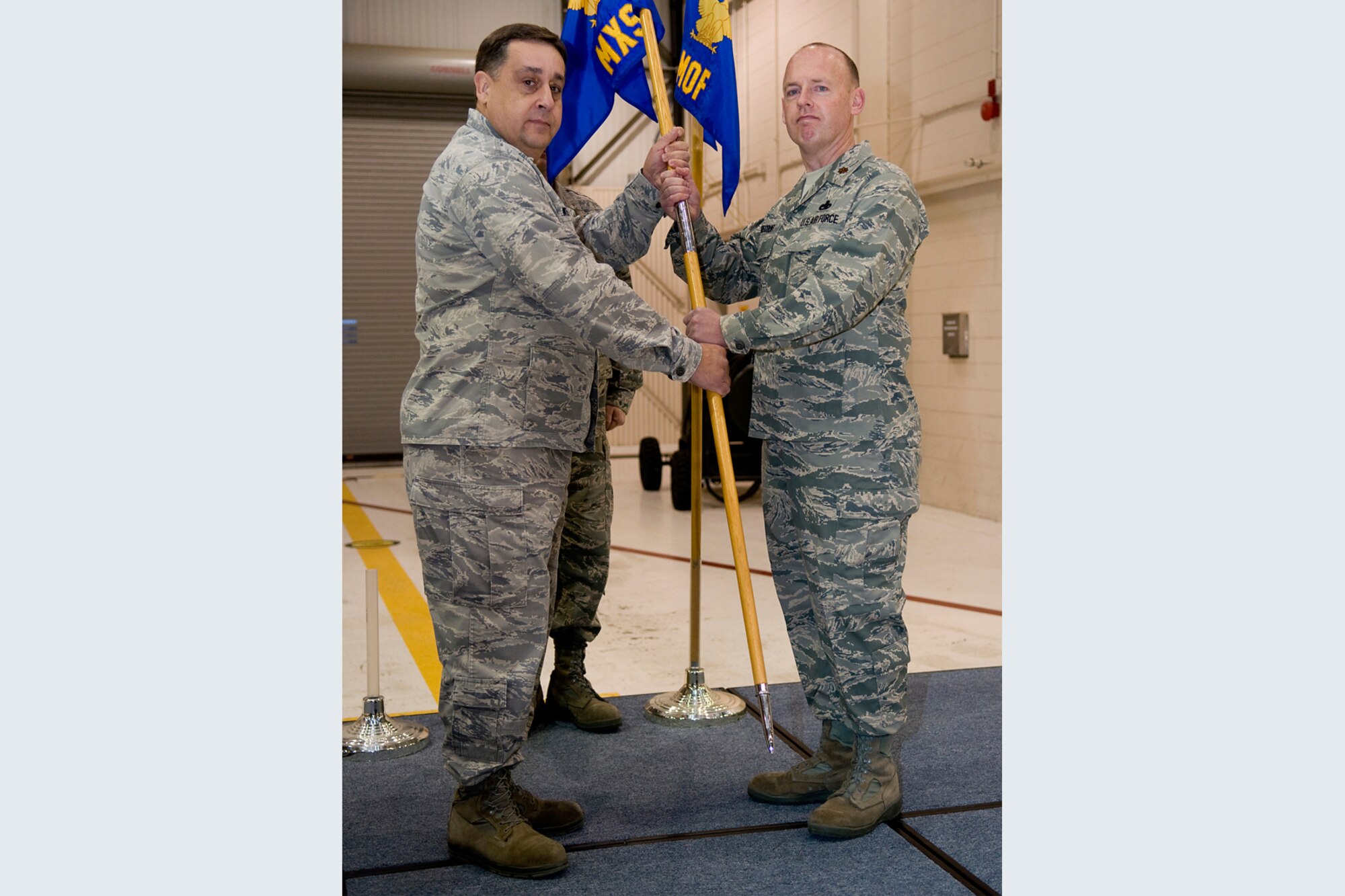 GRISSOM AIR RESERVE BASE, Ind. -- Maj. Joel Brecount accepts command of  the 434th Aircraft Maintenance Squadron from Col. Paul Weimer during a change of command ceremony here Jan. 7. During the ceremony, Brecount relinquished command of the 434th Maintenance Operations Flight prior to assuming command off the 434th AMXS. Weimer is the 434th Maintenance Group commander. (U.S. Air Force photo/Tech. Sgt. Mark R. W. Orders-Woempner) 
