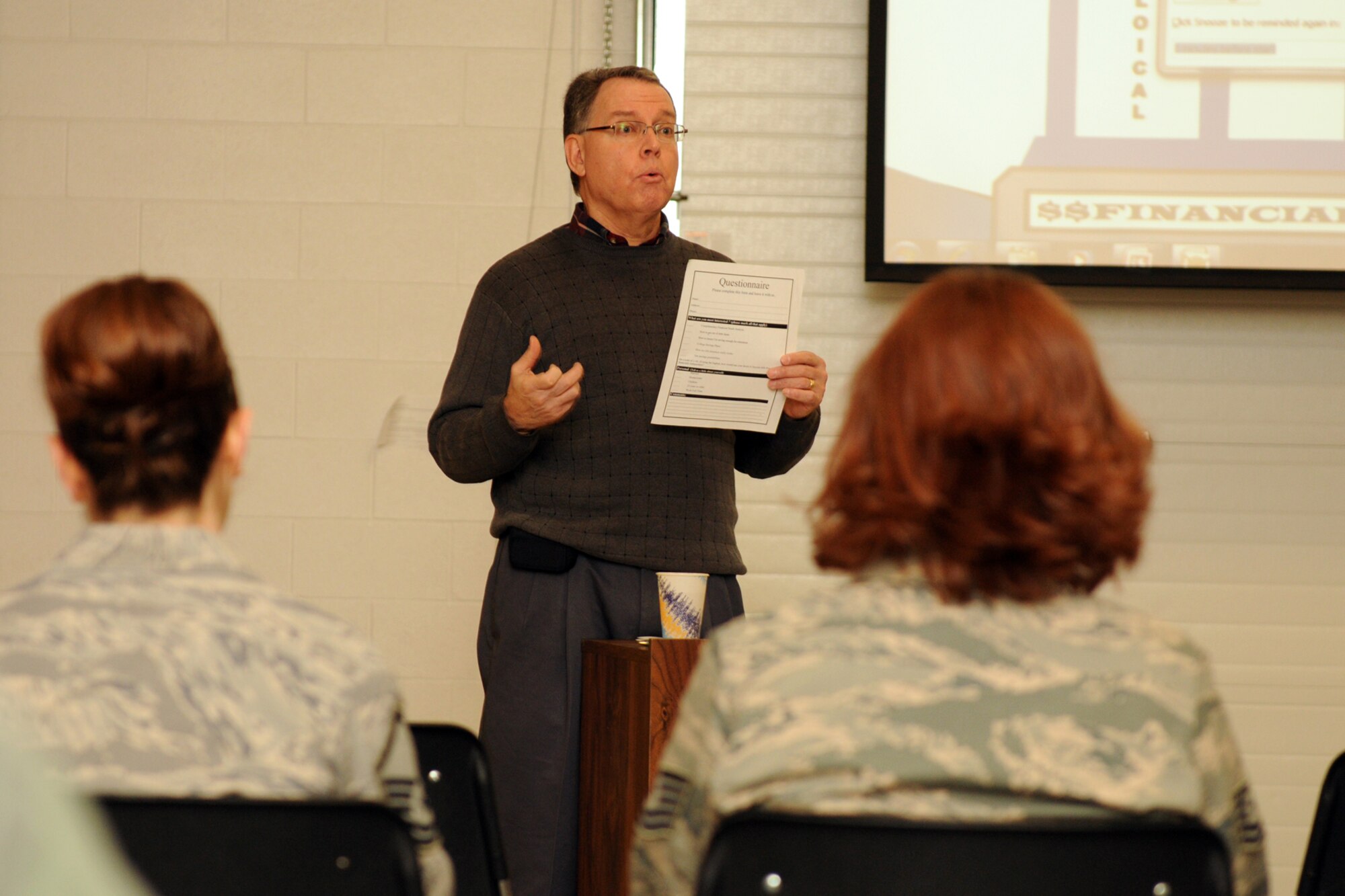 Members of Hancock Field Air National Guard Base, Syracuse NY, listen intently to Mr. Luis Gonzalez brief them on financial fitness in the newly opened Joint Deployment Health and Wellness Center (J-HAWC) on base. Mr. Gonzalez is a financial professional volunteering his time to advise unit members how to achieve their goals of debt reduction, budget planning and retirement security. Mr. Gonzalez preformed two briefings during the January UTA. (USAF photo by Staff Sgt. James N. Faso II/RELEASED)