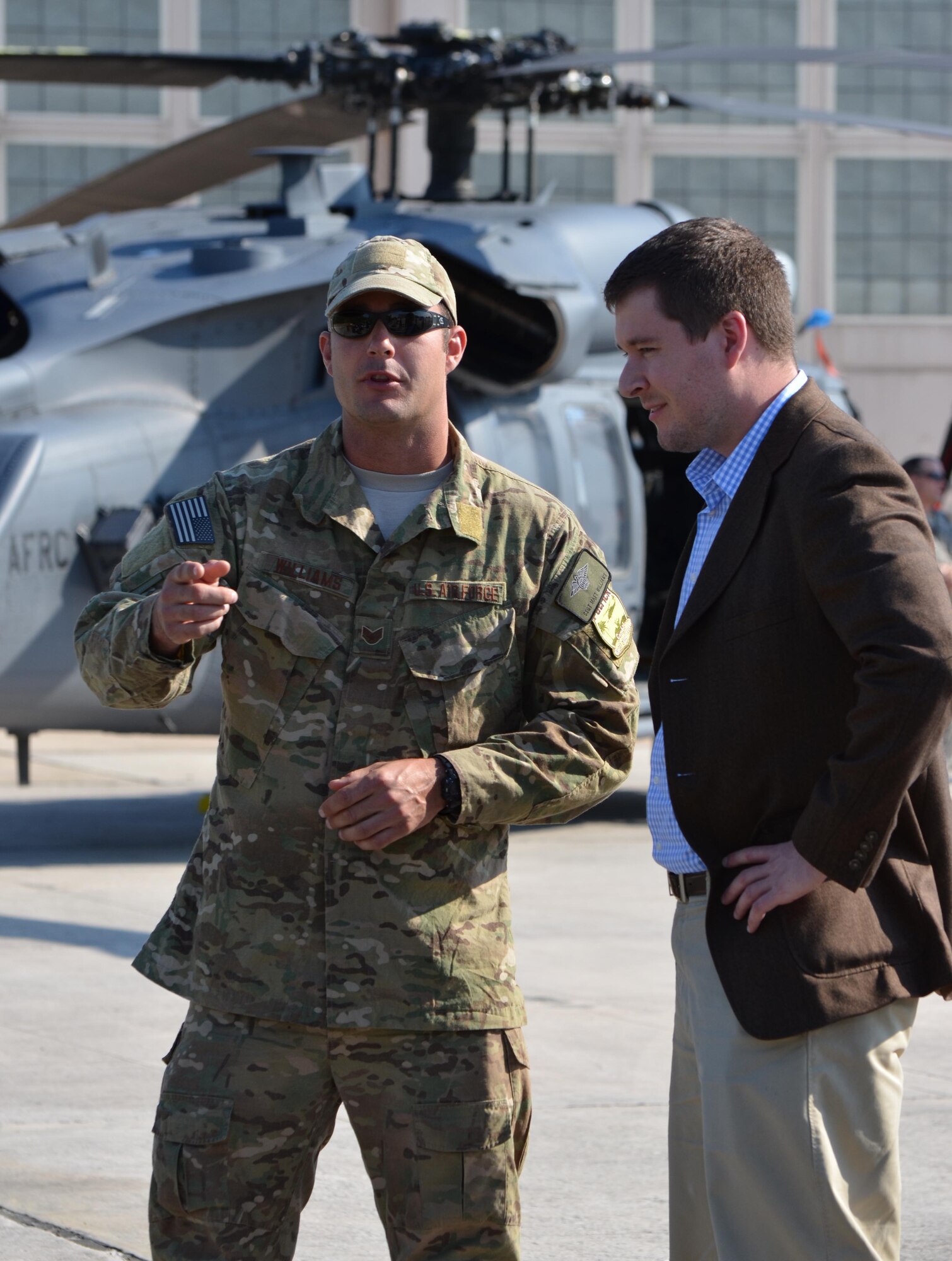 Staff Sgt. Matt Williams, 920th Rescue Wing pararescueman, explains pararescue equipment, out as Ryan Canfield looks on. Canfield is one of seven Congressional Staff Members who visited Patrick Air Force Base, Fla.,  Jan. 7, 2012. (U.S. Air Force Photo/Capt. Ryan Liss)