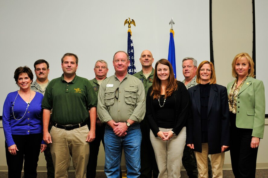 The 919th Special Operations Wing’s new honorary commanders pose for a group photo with the Reserve unit’s senior leaders during the recent induction ceremony at Duke Field, Fla.  Front row from left:  Pamela Woodall, Beach Community Mortgage; Jason Stokes, New Beginnings Church; Richard Harless, Beach Community Mortgage; Jackie Blue, Cayo Grande Suites Hotel; Peggy Moravec, Four Points by Sheraton; and Angela Campbell, Navarre Area Board of Realtors.  Back row from left:  Colonels Houston Sewell, 919th Support Group commander; Don Buckley, 919th Operations Group commander;  Andy Comtois, 919th SOW commander;  and Ken Honaker, 919th Maintenance Group commander.  (Not shown: Col. (Dr.)  Edward Seeliger, 919th Medical Squadron commander).  The honorary commanders program allows local community members a unique opportunity to interact with and learn about the wing’s Citizen Commandos, their mission and the role they play in supporting the Air Force. Honoraries may invite commanders to community functions, building and maintaining positive relationships between the military and local communities. (U.S. Air Force photo/Tech. Sgt. Samuel King Jr.)  