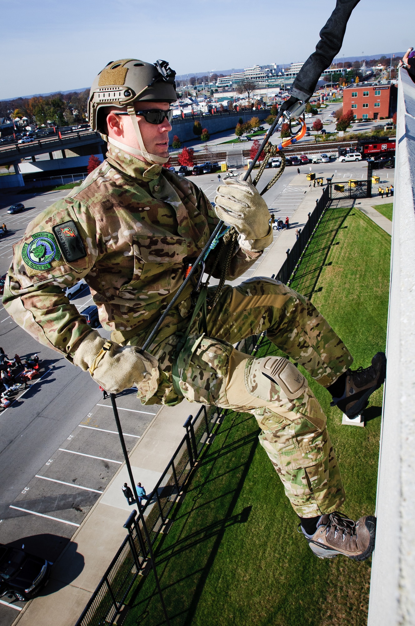 Staff Sgt. Adam Becker, a pararescueman from the Kentucky Air National Guard's 123rd Special Tactics Squadron, rappels down the side of University of Louisville Cardinal Stadium in Louisville, Ky., prior to the school's football match with Pittsburgh Nov. 12, 2011. The tactical demonstration was part of the school's annual Military Appreciation Day. (U.S. Air Force photo by Senior Airman Maxwell Rechel)