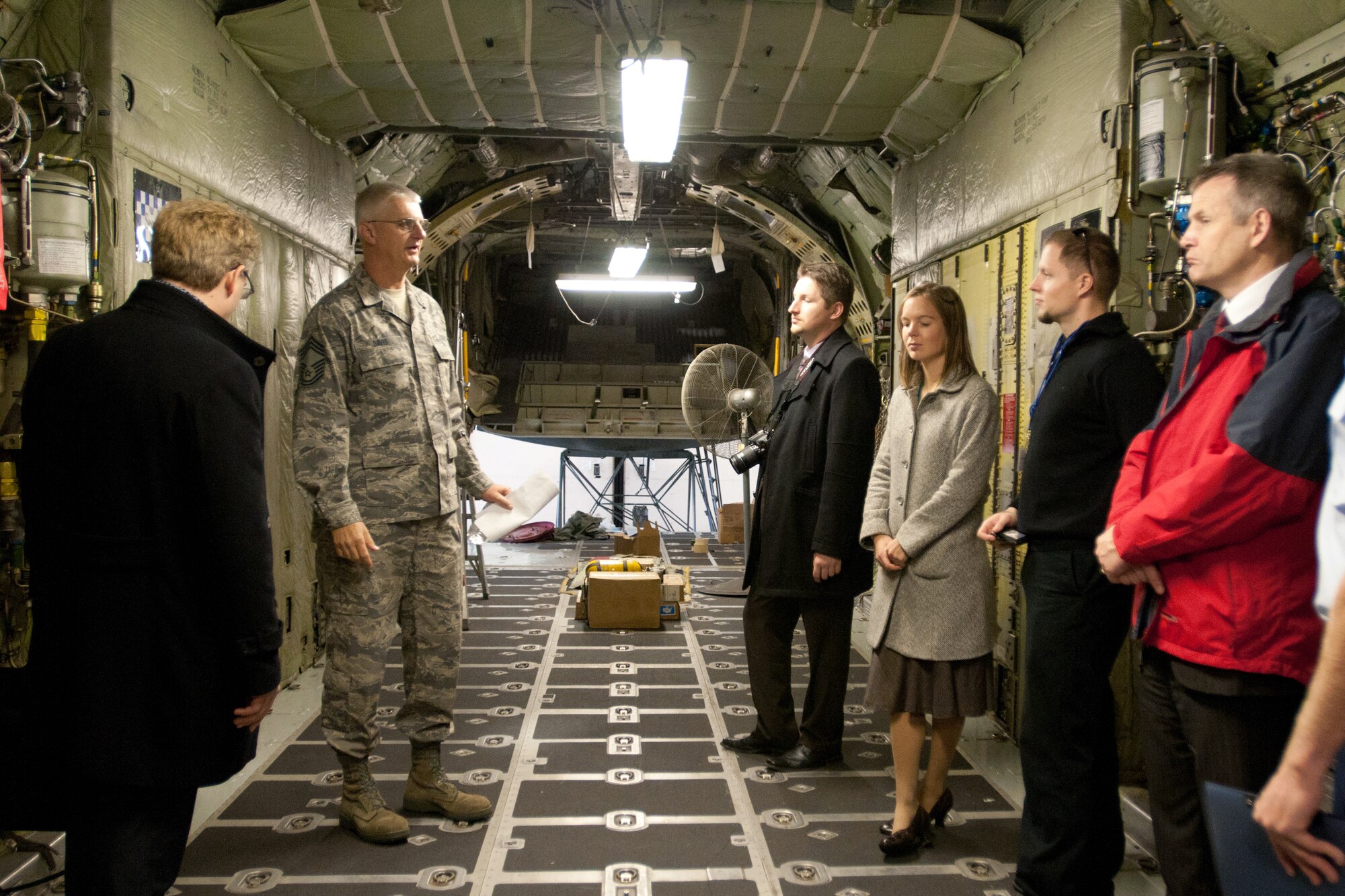 Chief Master Sgt. Bill Davis, a component maintenance flight chief for the 123rd Maintenance Squadron, briefs international military officials on the C-130's cargo bay during a tour of the Kentucky Air National Guard Base in Louisville, Ky., on Nov. 14, 2011. The officials were visiting as part of a leadership program affiliated with the U.S. State Department. (U.S. Air Force photo by Master Sgt. Phil Speck)