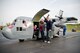 Family members of Kentucky Air Guardsmen exit the 123rd Airlift Wing's Mini C-130 after an orientation 