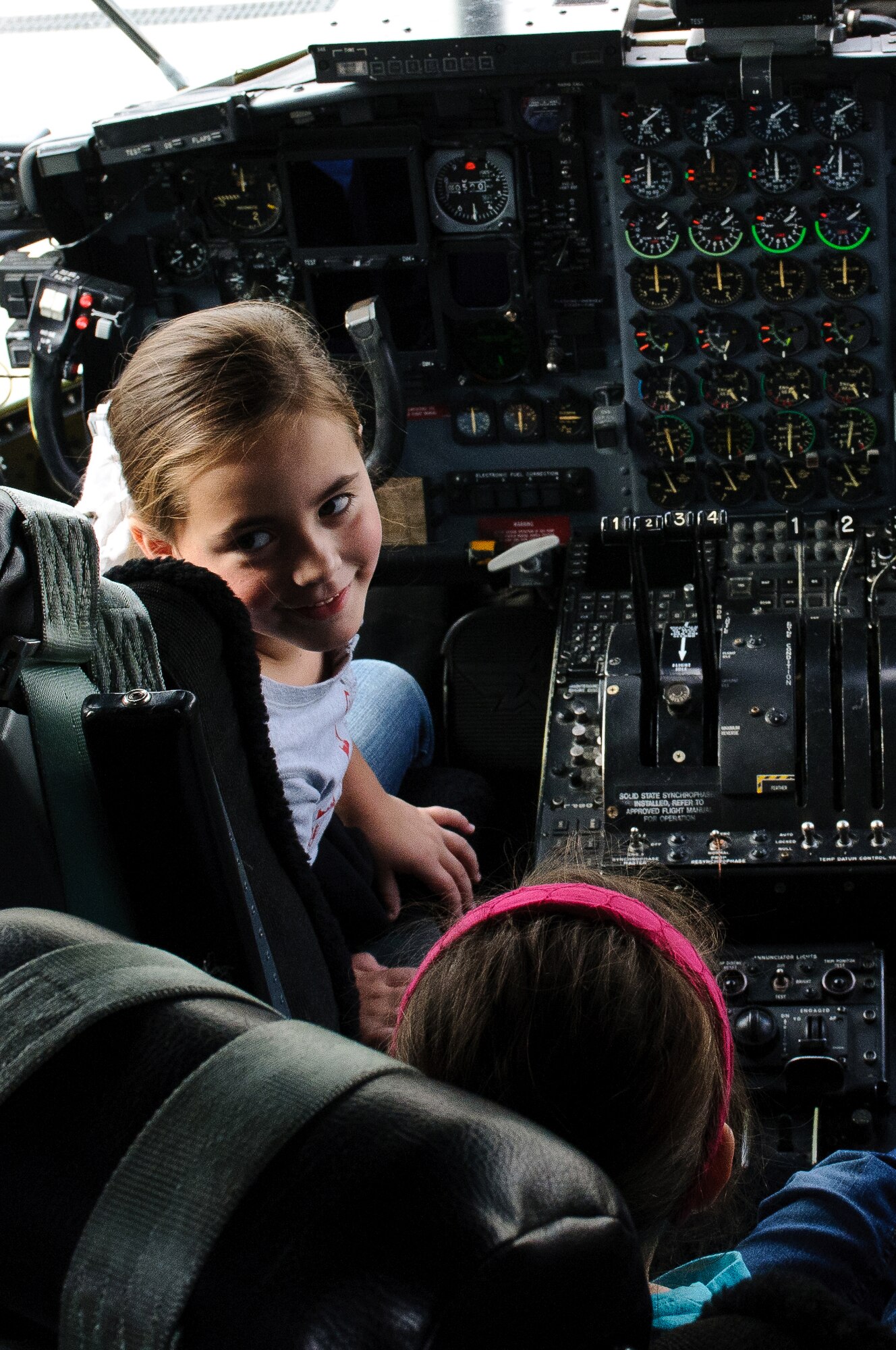 Madison Goddard, daughter of 1st Lt. Jarret Goddard of the Kentucky Air Guard's 123rd Civil Engineer Squadron, sits in the pilot's seat of a C-130 Hercules during the 123rd Airlift Wing's annual Family Day, held Oct. 23, 2011, in Louisville, Ky. More than 1,000 family members attended the event. (U.S. Air Force photo by Senior Airman Maxwell Rechel)
