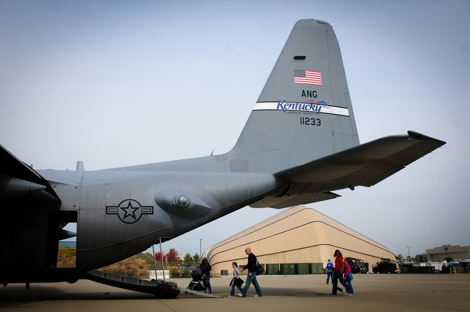 Family members of Airmen assigned to the 123rd Airlift Wing board a C-130 Hercules on display Oct. 23, 2011, during the unit's annual Family Day in Louisville, Ky. The event is held to celebrate and thank the families of Airmen who serve in the Kentucky Air National Guard. (U.S. Air Force photo by Senior Airman Maxwell Rechel)