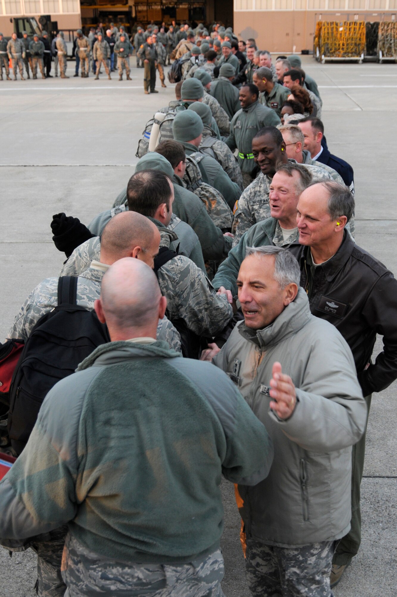 Airmen from the 127th Wing are greeted by Major General Gregory Vadnais (front right), the Michigan Adjutant General, as they arrive at Selfridge Air National Guard Base, Mich., Jan. 9, 2012, after a 4-month deployment to Kandahar Airfield in Afghanistan. The Airmen, all members of the 127th Wing at Selfridge, flew and maintained the A-10 Thunderbolt II attack aircraft while in Afghanistan. (U.S. Air Force photo by TSgt Dave Kujawa)