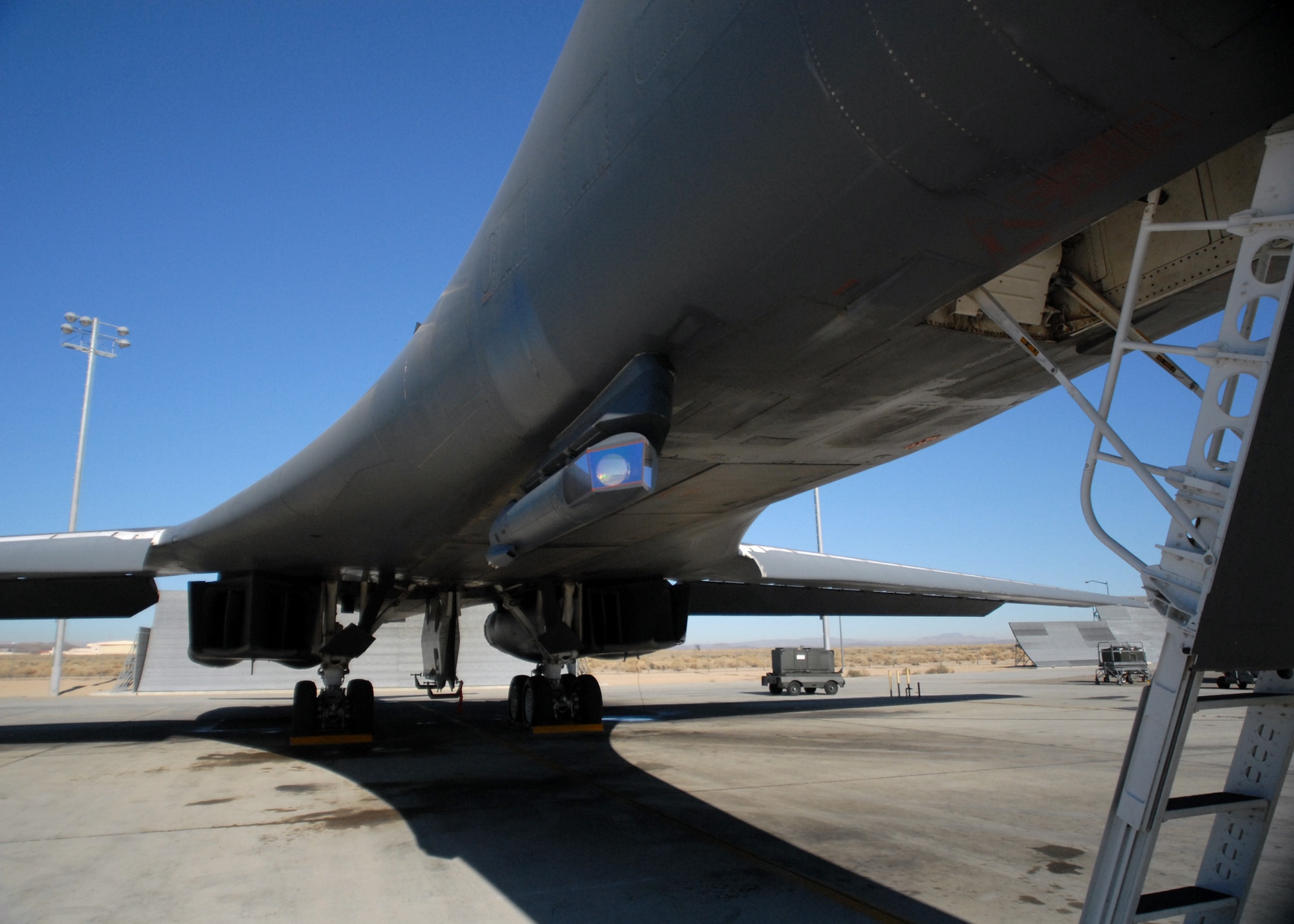 A pod positioned under the fuselage of a B-1B bomber was the part of the focus of a test conducted Nov. 15 by the 419th Flight Test Squadron and Global Power Bomber Combined Test Force and the 337th Test and Evaluation Squadron, Dyess AFB, Texas. The test completed the Laptop Controlled Targeting Pod Phase II upgrade to the B-1. The upgrade gives the aircraft new capabilities including a reduced timeline to find and strike moving targets in close air support of ground troops. (U.S Air Force photo by Kate Blais)