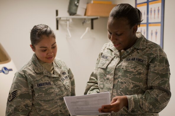 U.S. Air Force Staff Sgt. Terri Miller, 23rd Aerospace Medicine Squadron diet therapy technician, goes over Bod Pod results with Staff Sgt. Arlene Christmas, 820th Base Defense Group unit deployment manager, Jan 6, 2012. Miller works in the Moody Air Force Base Health and Wellness Center and teaches nutrition classes to base community members. (U.S. Air Force photo by Airman 1st Class Jarrod Grammel/Released)
