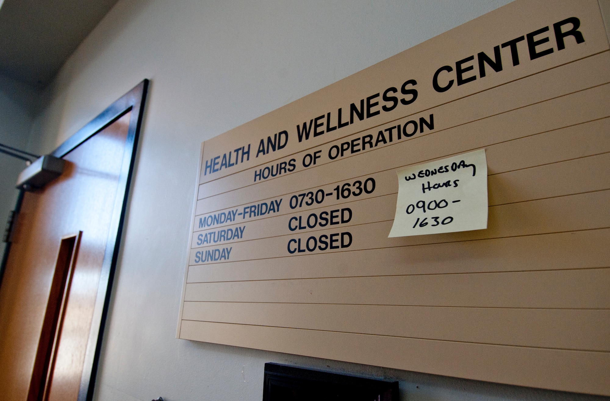 The sign outside the Health and Wellness Center displays the operating hours, at Moody Air Force Base, Ga., Jan. 6, 2012. The HAWC is staffed by six specialists who teach classes and advise base community members on healthy living. (U.S. Air Force photo by Airman 1st Class Jarrod Grammel/Released)
