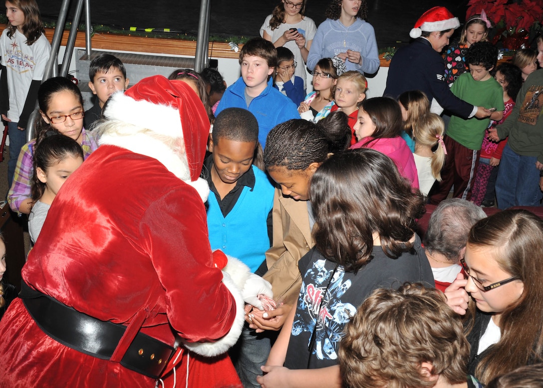 Santa greats children at the Band of the West's performance of Holiday in Blue