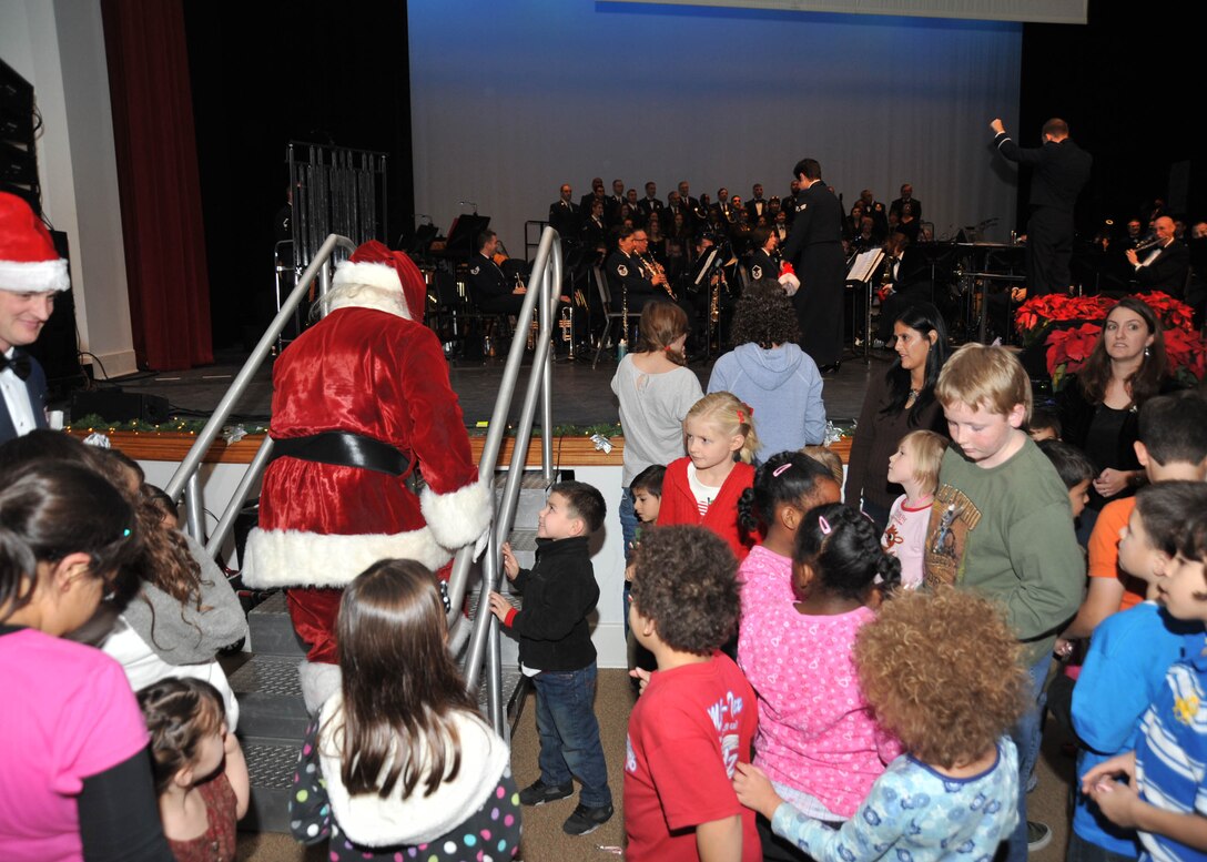Santa greats children at the Band of the West's Holiday in Blue performance.