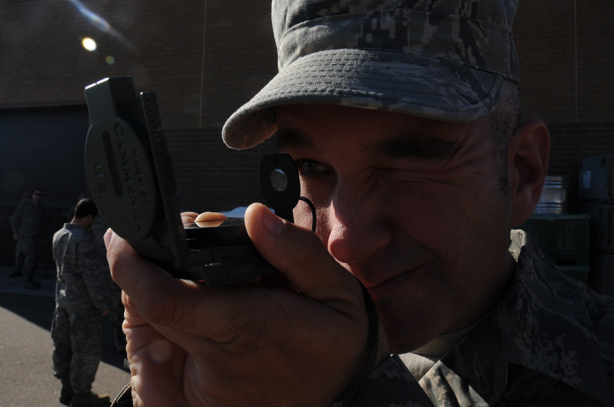 Tech. Sgt. Jesse R. Cisero, 944th Civil Engineer Squadron, electrical journeyman, shoots an azimuth using the “compass to check method,” Jan. 7 during land navigation training at the 944th CES Bldg., Luke Air Force Base, Ariz. (U.S. Air Force photo/Staff Sgt. Louis Vega Jr.)