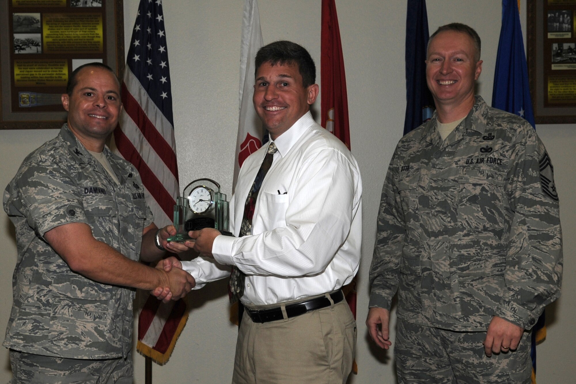 GOODFELLOW AIR FORCE BASE, Texas -- Col. Mark Damiano, 17th Training Wing Commander, and Chief Master Sgt. Quinton Otto, 17th Mission Support Group Superintendent, present the 17th Training Wing Civilian Supervisor of the Quarter Category II to Samuel Spooner, 17th Training Wing Staff, during the wing quarterly awards ceremony Jan. 5. (U.S. Air Force photo/Staff Sgt. Laura R. McFarlane)