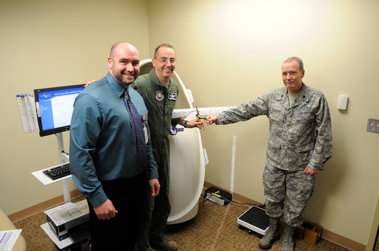VANDENBERG AIR FORCE BASE, Calif. - Jonathan Low, the Health and Wellness Center’s health promotion program manager, Col. Keith Balts, 30th Space Wing vice commander, and Lt. Col. Peter D. Reinhardt, 30th Medical Group deputy commander, officially launch the Bod Pod located at the 30th Medical Group here Friday, Jan. 6, 2012. (U.S. Air Force photo/ Tech. Sgt. Scottie McCord) 