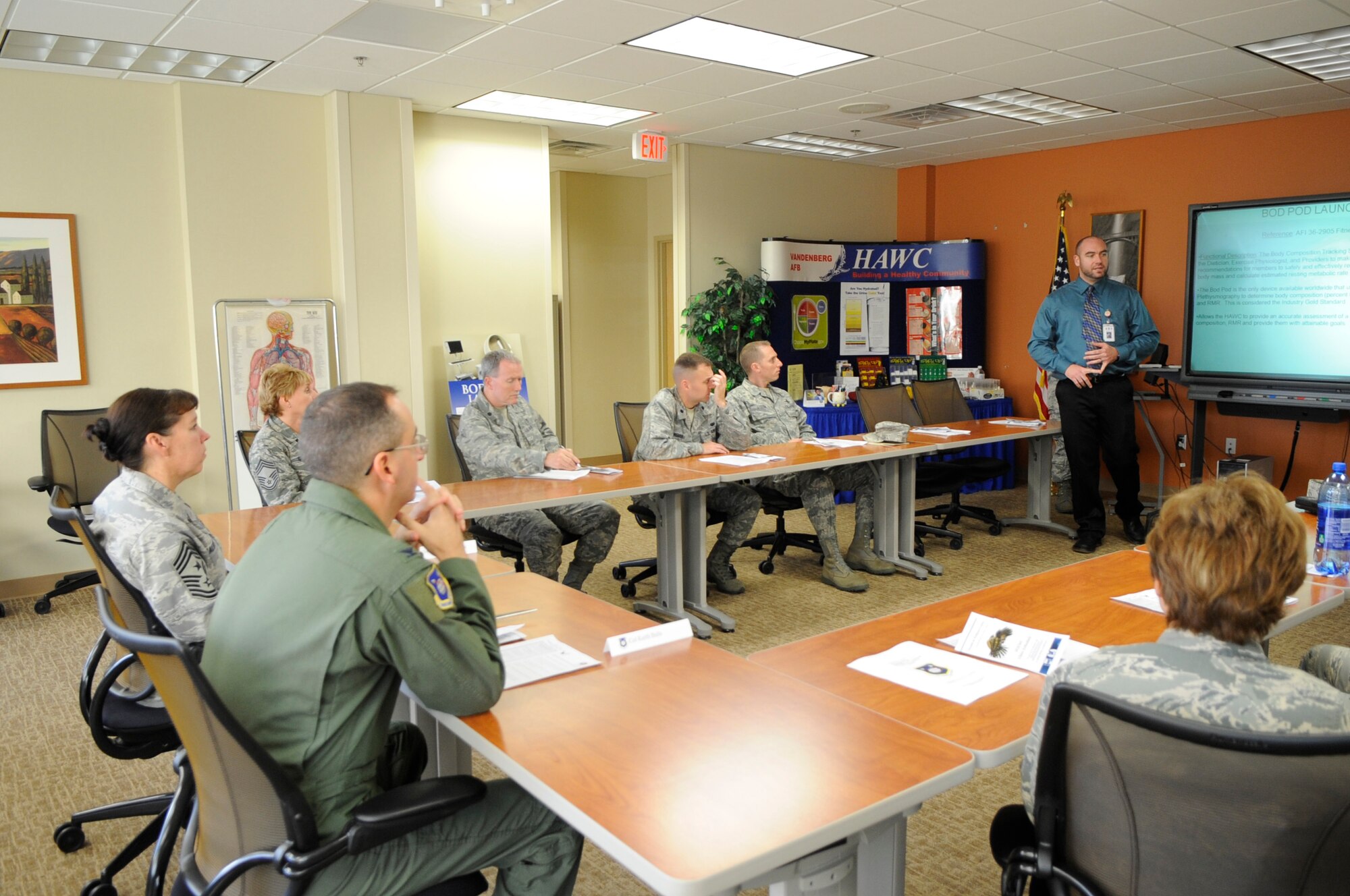 VANDENBERG AIR FORCE BASE, Calif. - Jonathan Low, the Health and Wellness Center’s health promotion program manager, briefs wing leadership on the new Bod Pod located at the 30th Medical Group here Friday, Jan. 6, 2012. A BOD POD is an egg-shaped chamber used to determine a person’s lean body mass and with average test and retest variation within 2 percent body fat. (U.S. Air Force photo/ Tech. Sgt. Scottie McCord) 