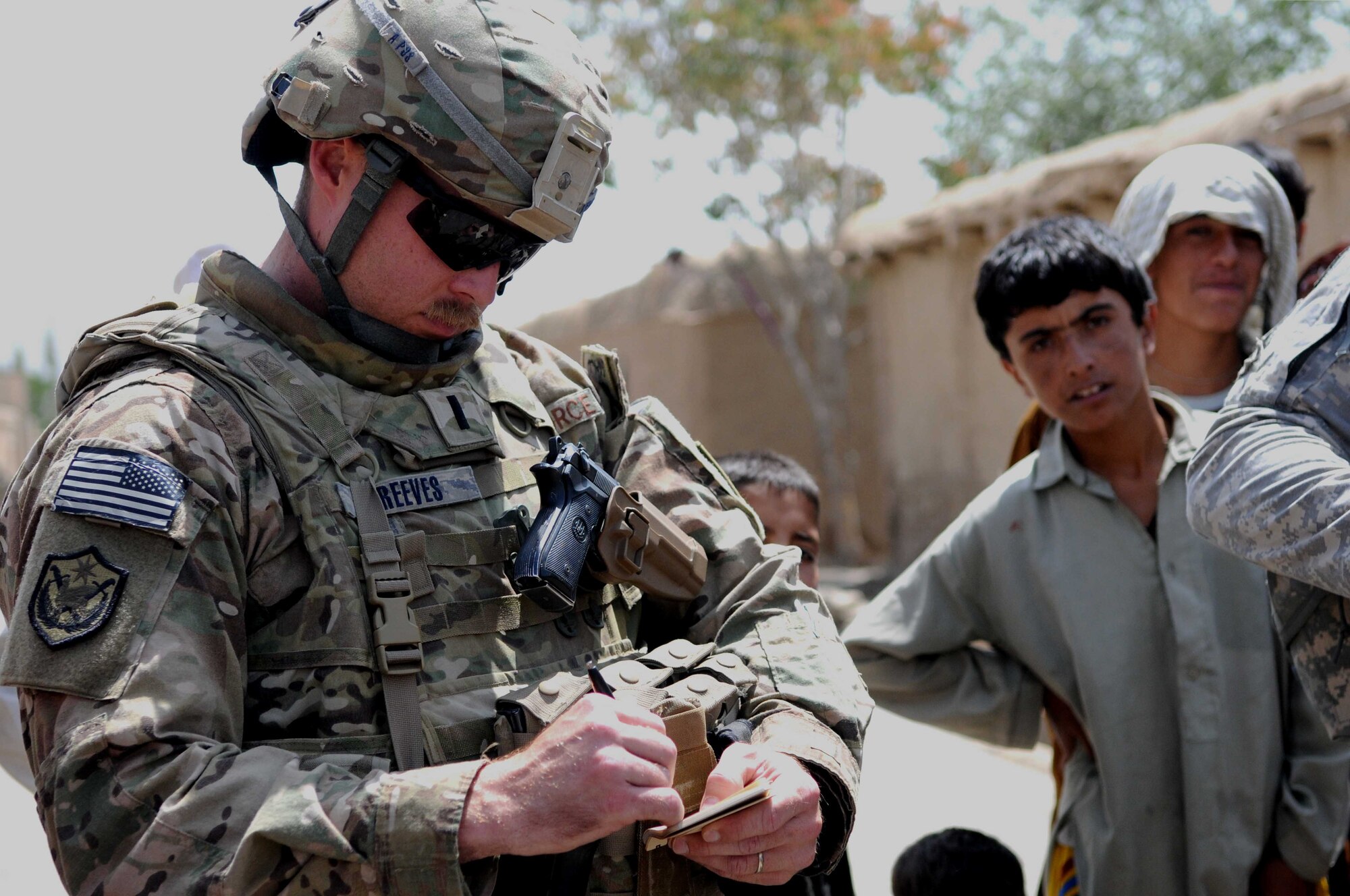 PAKTYA PROVINCE, Afghanistan-- U.S. Air Force 1st Lt. Cale Reeves discusses ongoing Gardez City road projects during a quality assessment in Paktya Province, Afghanistan, Aug. 11. Reeves is a Paktya PRT engineer from Angleton, Texas.  He received his commission from the United States Air Force Academy in 2008 with a degree in civil engineering. (U.S. Air Force photo/1st Lt. Cammie Quinn, Paktya PRT Public Affairs)  
