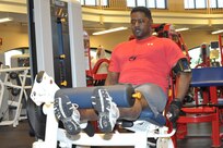 Greg J-Douglas, Air Force Personnel Center Senior Program analyst, works on his New Year's resolution of "losing the stomach and getting lean" at the Rambler Fitness Center Wednesday. (U.S. Air Force photo/Airman 1st Class Alexis Siekert)