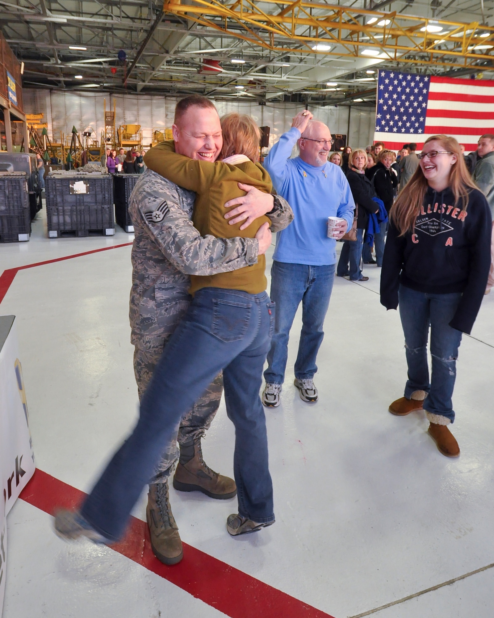 Staff Sgt. Tom Olson, 934th Maintenance Group crew chief, gets a hug from a co-worker before his deployment to Southwest Asia. (Air Force Photo/Tech Sgt. Bob Sommer)