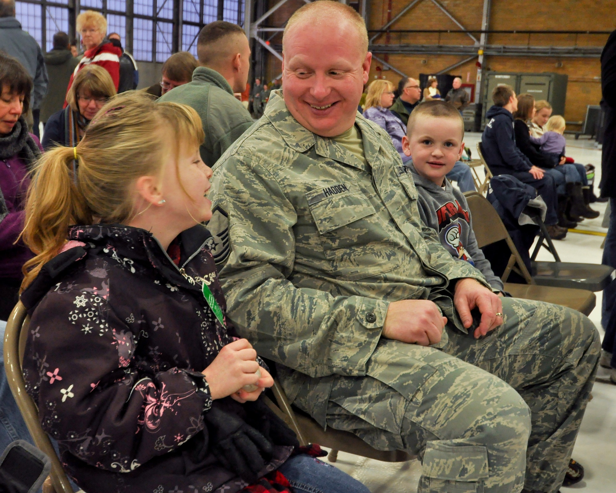 Master Sgt. Jeremy Hadden, 934th Maintenance Group crew chief, spends some time with his children Halieigh, 8, and Jase, 6, before deploying to Southwest Asia. (Air Force Photo/Tech Sgt. Bob Sommer)