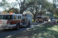 Engine 5, Rescue and Engine 10 driven by Joint Base San Antonio-Randolph Fire Emergency Services stand by during a structural fire exercise conducted Dec. 7.
Photo by Don Lindsey