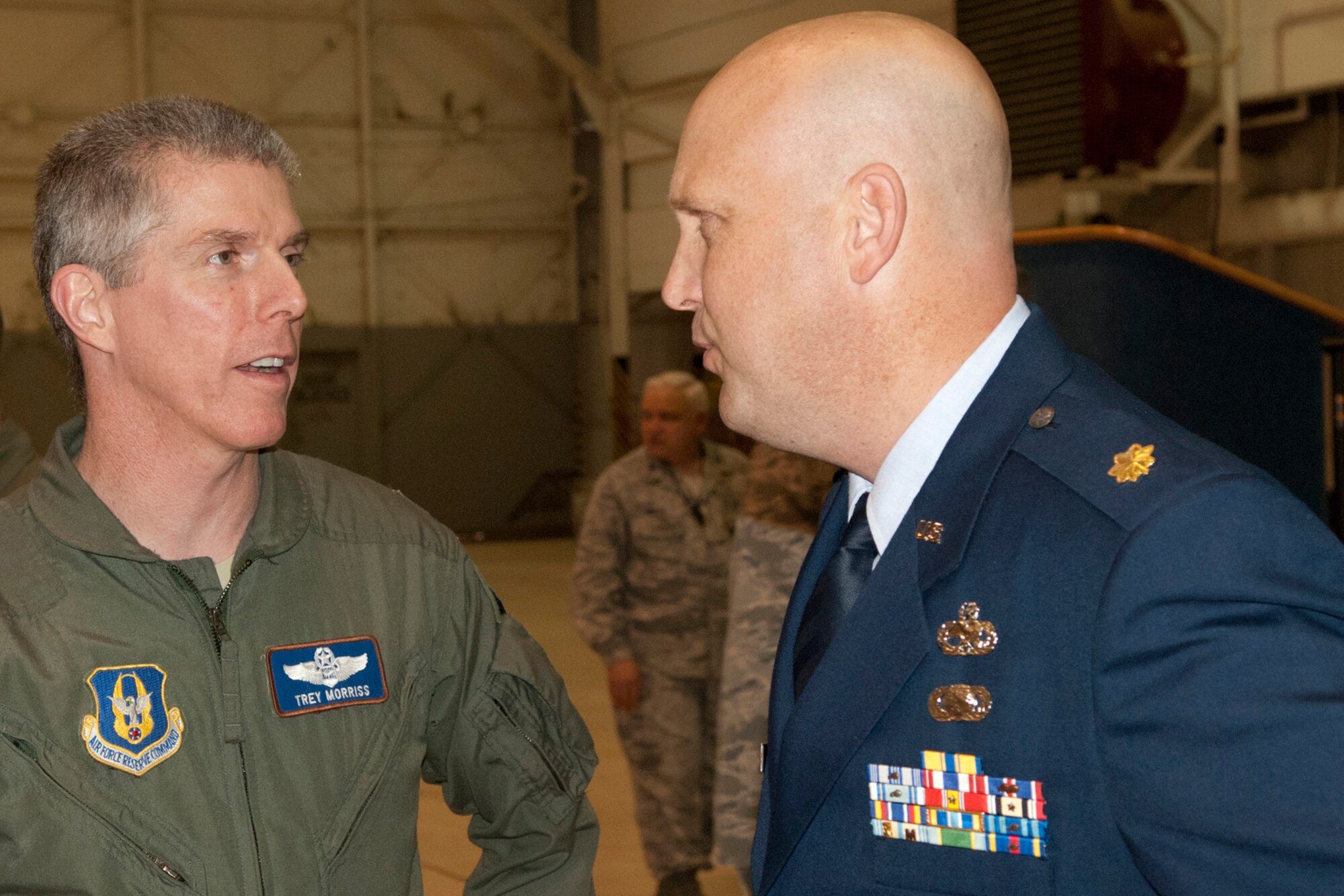 Lt. Col. James Morriss, III, the 307th Operations Group Deputy commander, welcomes Maj. Karwin Weaver, the new 307th Aircraft Maintenance Squadron commander, to the 307th Bomb Wing during a reception at Barksdale Air Force Base, La. , Jan. 7, 2012.  The reception provided Airmen of the wing an opportunity to meet the new commander. (U.S. Air Force Photo by Staff Sgt. Ted Daigle, Released)