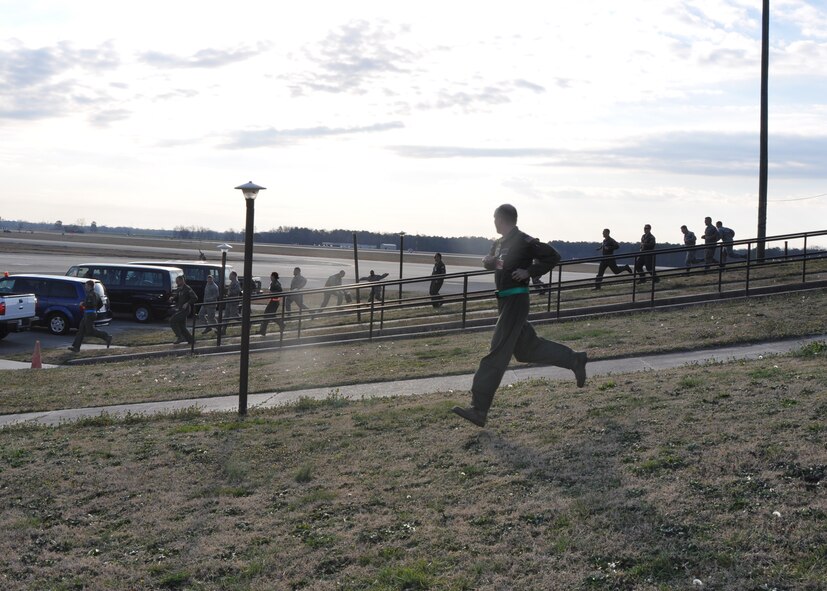 Air crews from the 916th Air Refueling Wing race from the alert facility after receiving notification of a simulated crisis. The wing conducted an exercise during their January drill weekend in order to prepare for an inspection scheduled for 2013. (USAF photo by Maj. Erin Karl, 916ARW/PA)