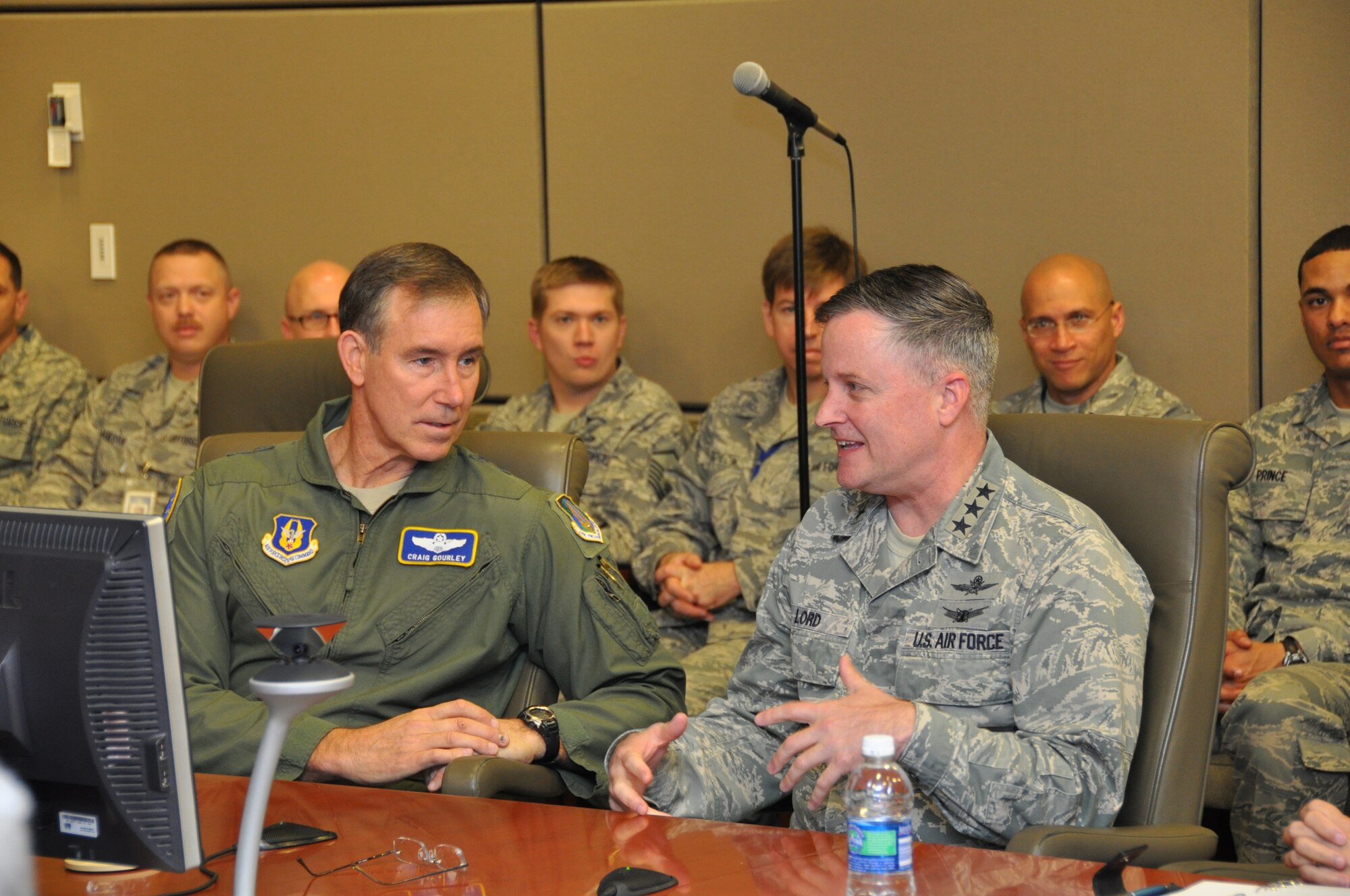 ROBINS AIR FORCE BASE, Ga. -- Lt. Gen. William T. Lord, Air Force chief of Warfighting Integration and Chief Information Officer, converses with Maj. Gen. Craig Neil Gourley, Air Force Reserve Command vice commander, just before a video teleconference session with the command's cyber warriors in the AFRC headquarters conference room. General Lord visited AFRC and the 689th Combat Communications Wing here, Jan. 6-7, 2012. (U.S. Air Force photo/Capt. Polly Orcutt)