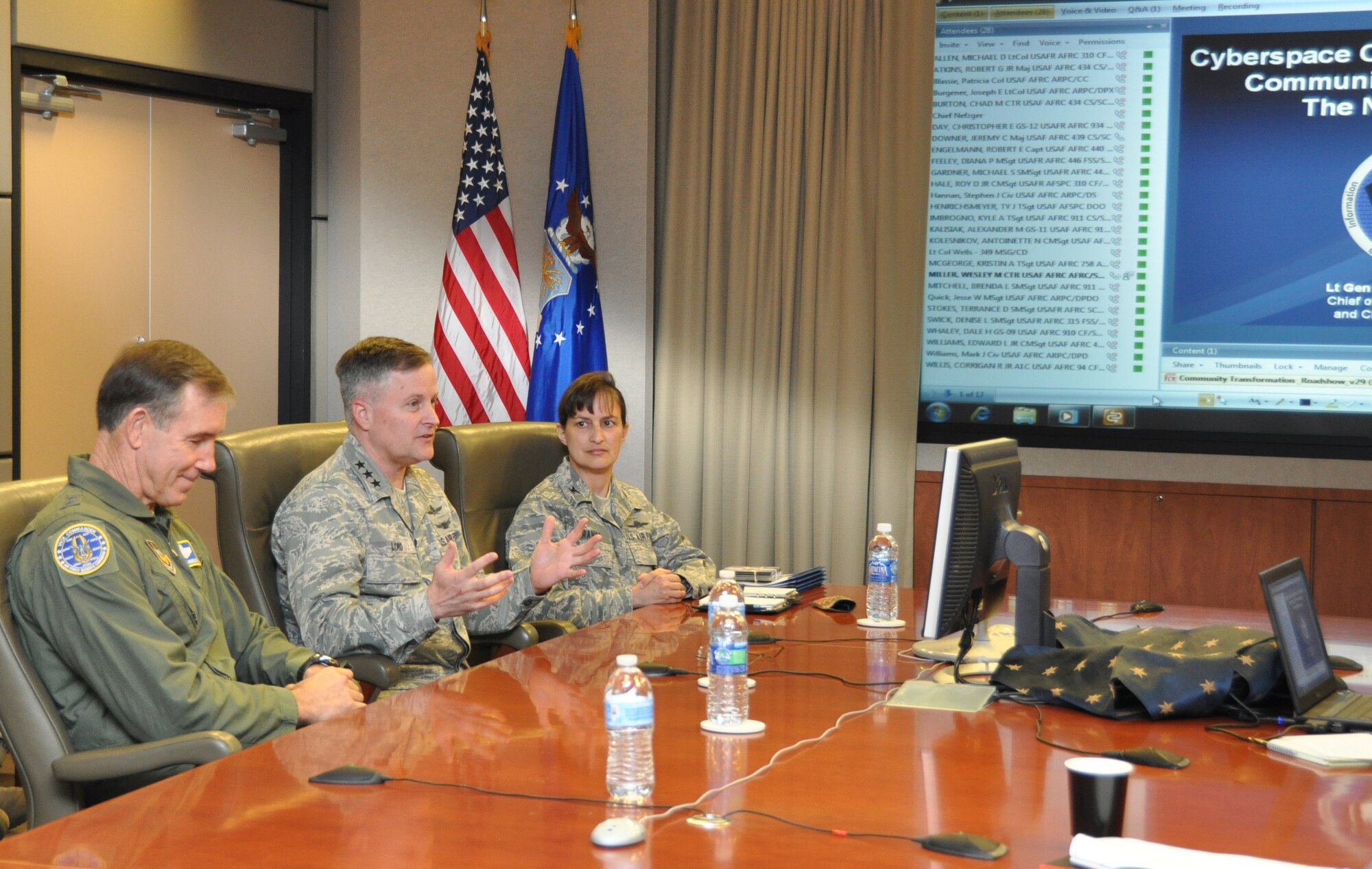 ROBINS AIR FORCE BASE, Ga. -- Lt. Gen. William T. Lord, Air Force chief of Warfighting Integration and Chief Information Officer, (center) conducts a video teleconference with Air Force Reserve Command cyber warriors. Flanking Lord are, left, Maj. Gen. Craig Neil Gourley, Air Force Reserve Command vice commander and Col. Kimberly Ramos, AFRC/A6 director. The teleconference with field communications units was part of Lord’s visit with AFRC and the 689th Combat Communications Wing here, Jan. 6-7, 2012. (U.S. Air Force photo/Capt. Polly Orcutt)
