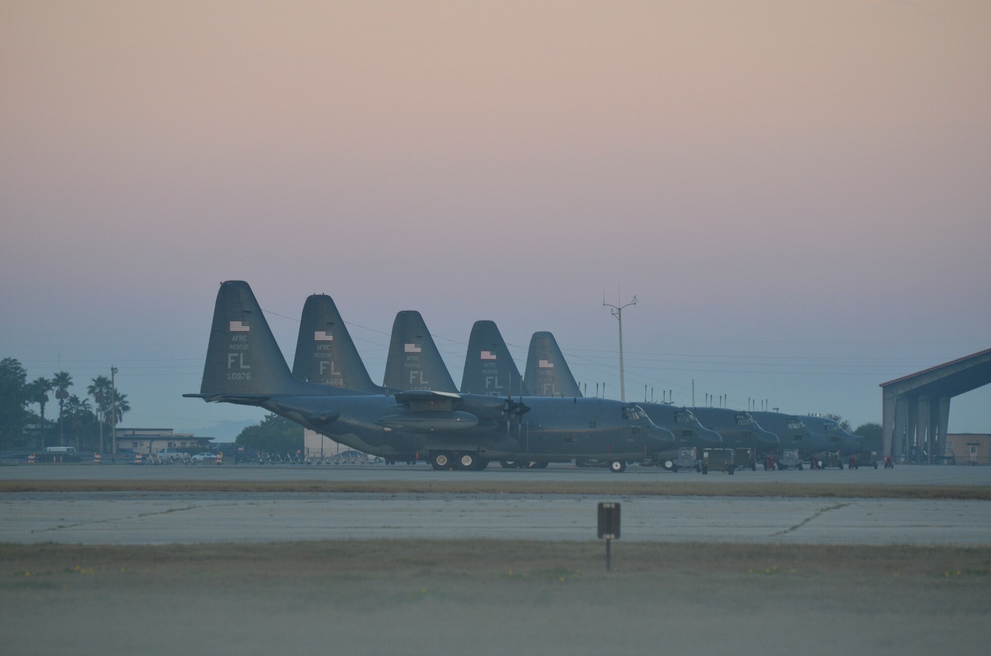 The 920th Rescue Wing fleet of HC-130P/N King aircraft line the Patrick Air Force Base flightline Jan. 9 as maintenance Airmen prepare to go to work on them. During weekend drill training Jan 6-7, aircrew Airmen exercised their flying muscles on local training flights to keep their flight currencies up to date. There were approximately 1,100 920th Reserve Airmen at the base performing their war readiness training as they do one weekend every month. (U.S. Air Force photo/Capt. Cathleen Snow)